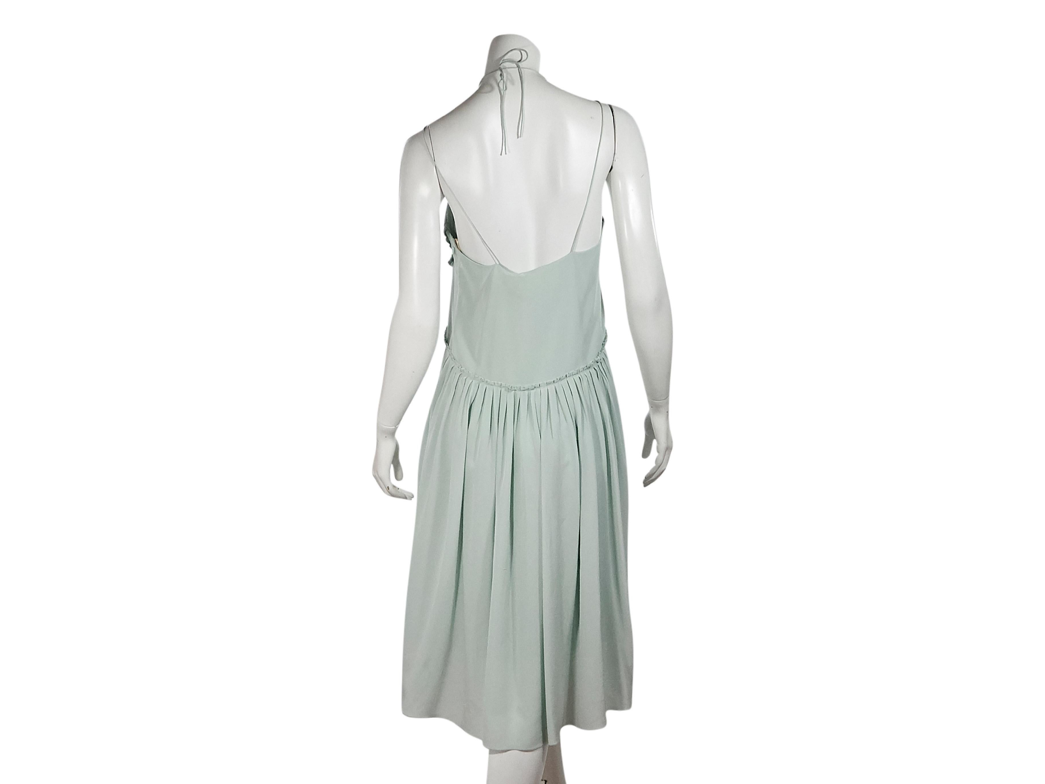 Product details:  Mint green pleated silk dress by Chloe.  Scoopneck.  Sleeveless.  Self-tie halterneck.  Concealed side zip closure.  33