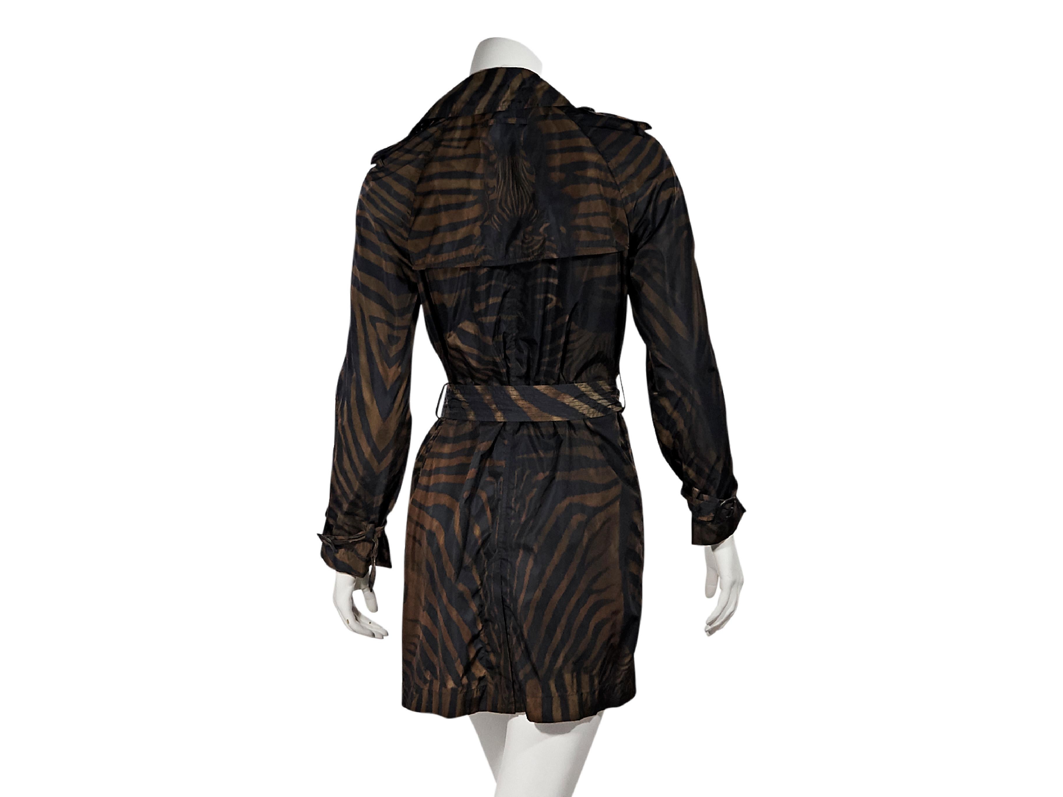 Product details:  Brown and black zebra-printed lightweight trench coat by Jean Paul Gaultier.  Notched lapel.  Long sleeves.  Button shoulder epaulettes.  Double-breasted button-front closure.  Adjustable belted waist.  Waist slide pockets.  Back