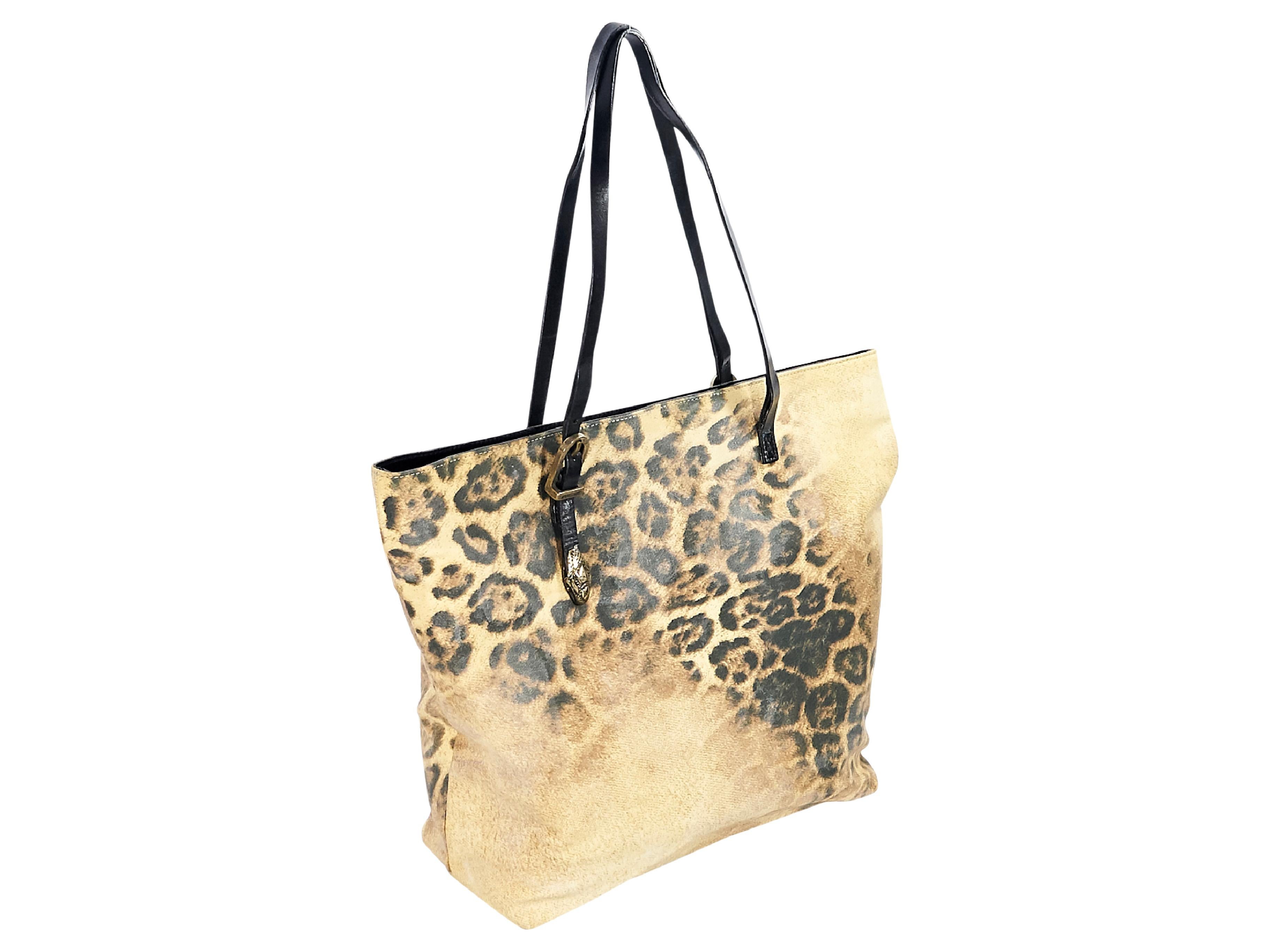 Product details:  Multicolor leopard-print leather and canvas tote bag by Roberto Cavalli.  Accented with whipstitched trim.  Dual shoulder straps.  Magnetic snap closure.  Lined interior with inner slide and zip pockets.  Goldtone hardware.  14