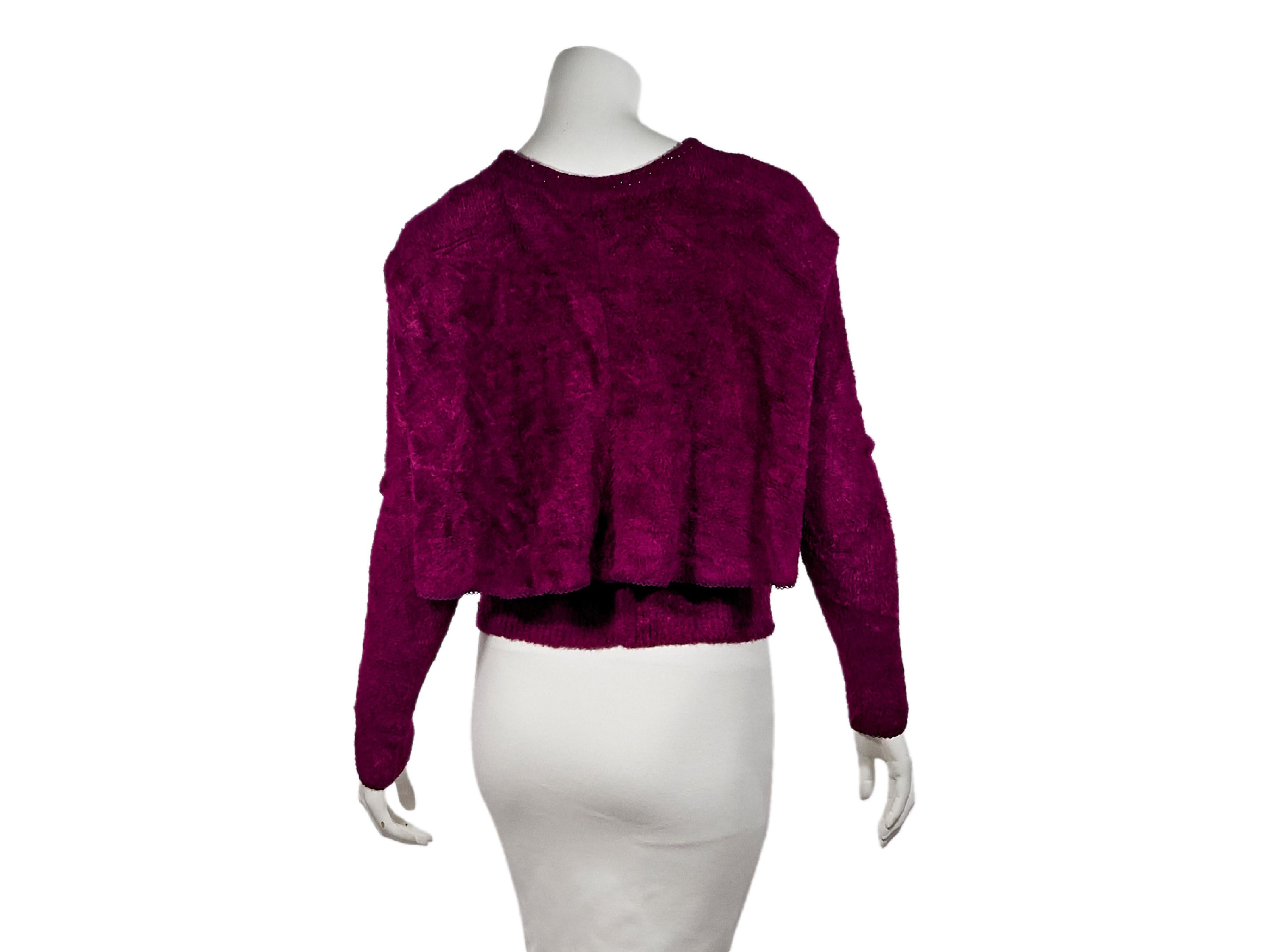 Product details:  Vintage purple cutout sweater by Alaia.  Front clasp closure.  Long sleeves.  Draped back.  Pullover style.  33