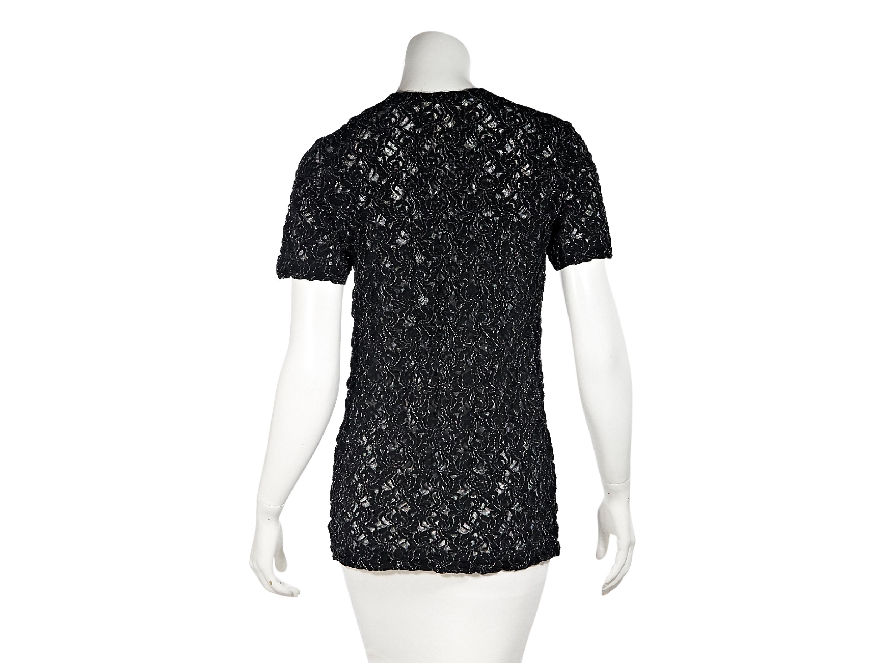 Product details:  Vintage black lace-like top by Comme des Garcons.  Jewelneck.  Short sleeves.  Pullover style.  34