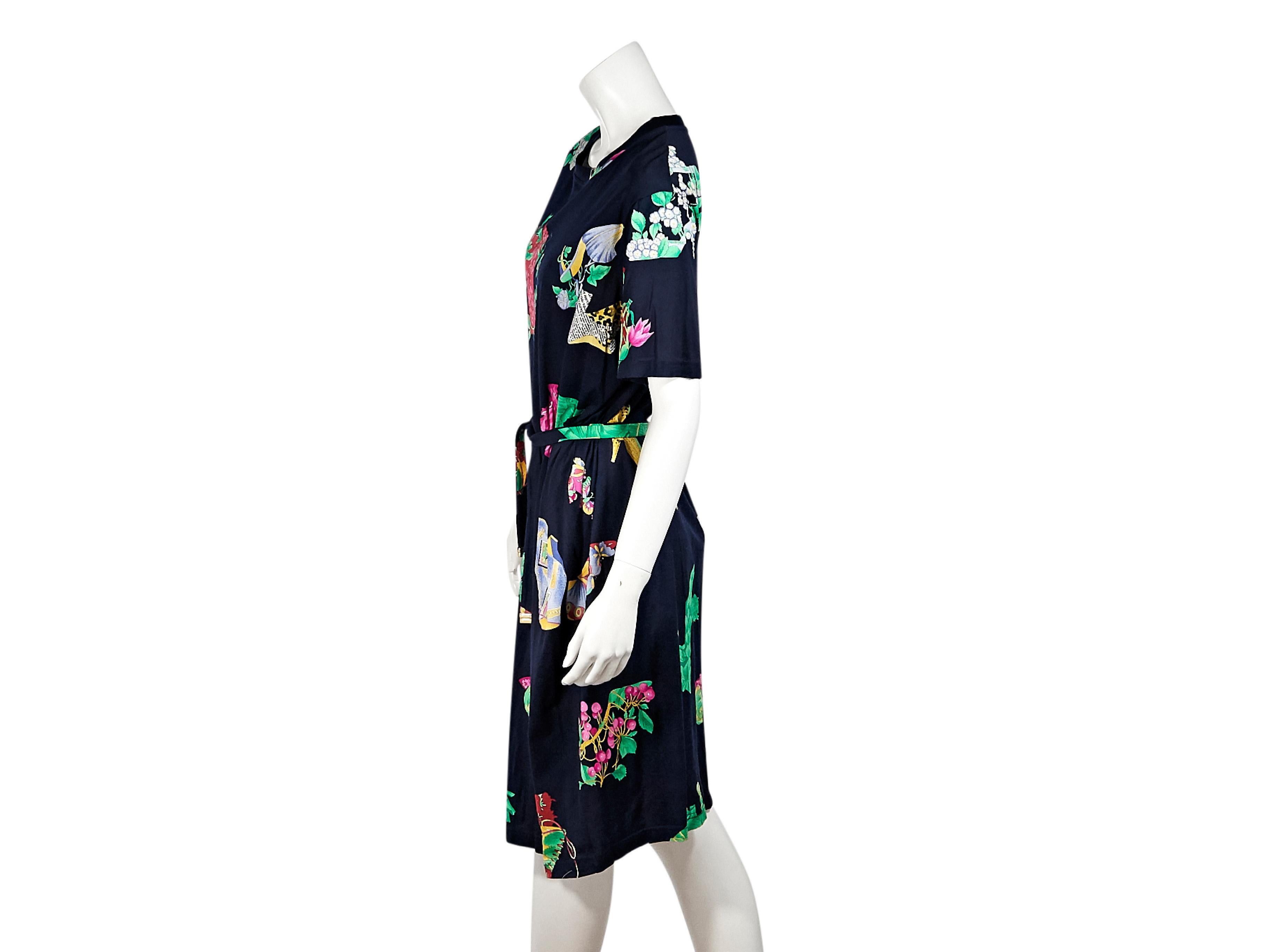 Product details:  Vintage multicolor printed cotton t-shirt dress by Leonard Paris.  Crewneck.  Elbow-length sleeves.  Self-tie belted waist.  Pullover style.  39