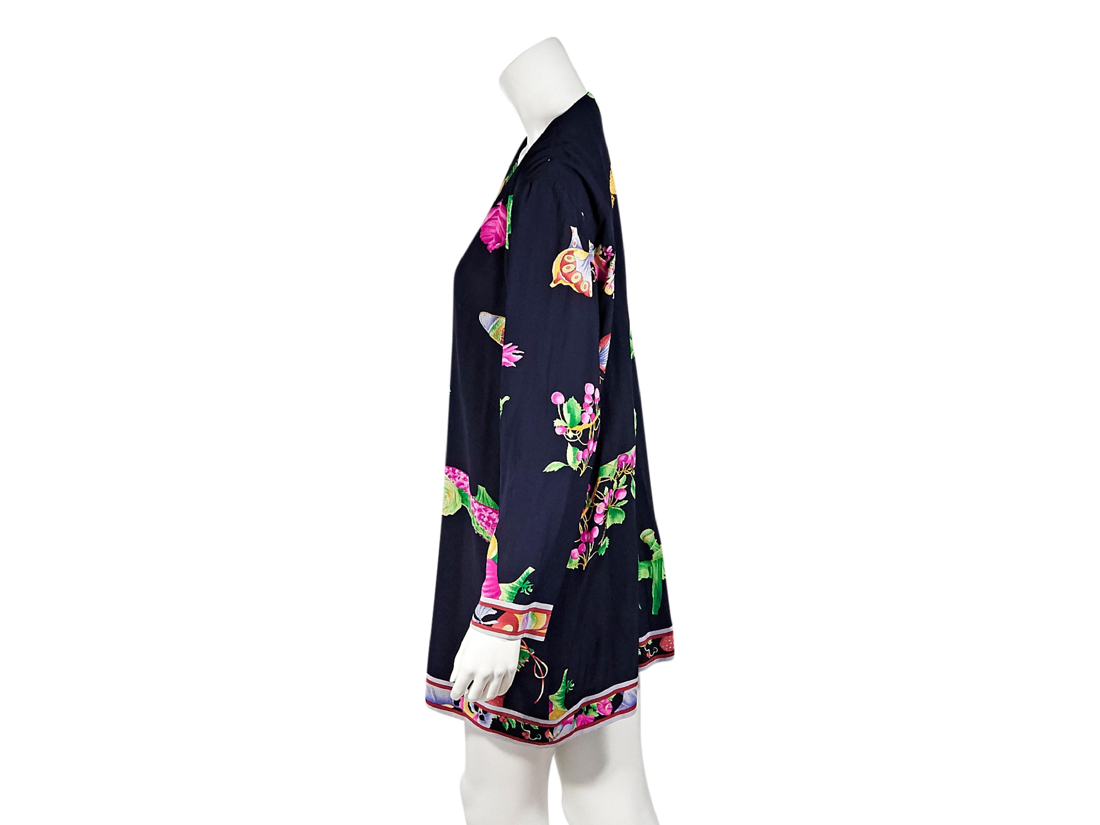 Product details:  Multicolor printed silk mini dress by Leonard Paris.  Deep v-neck.  Long sleeves.  Button-front closure.  42