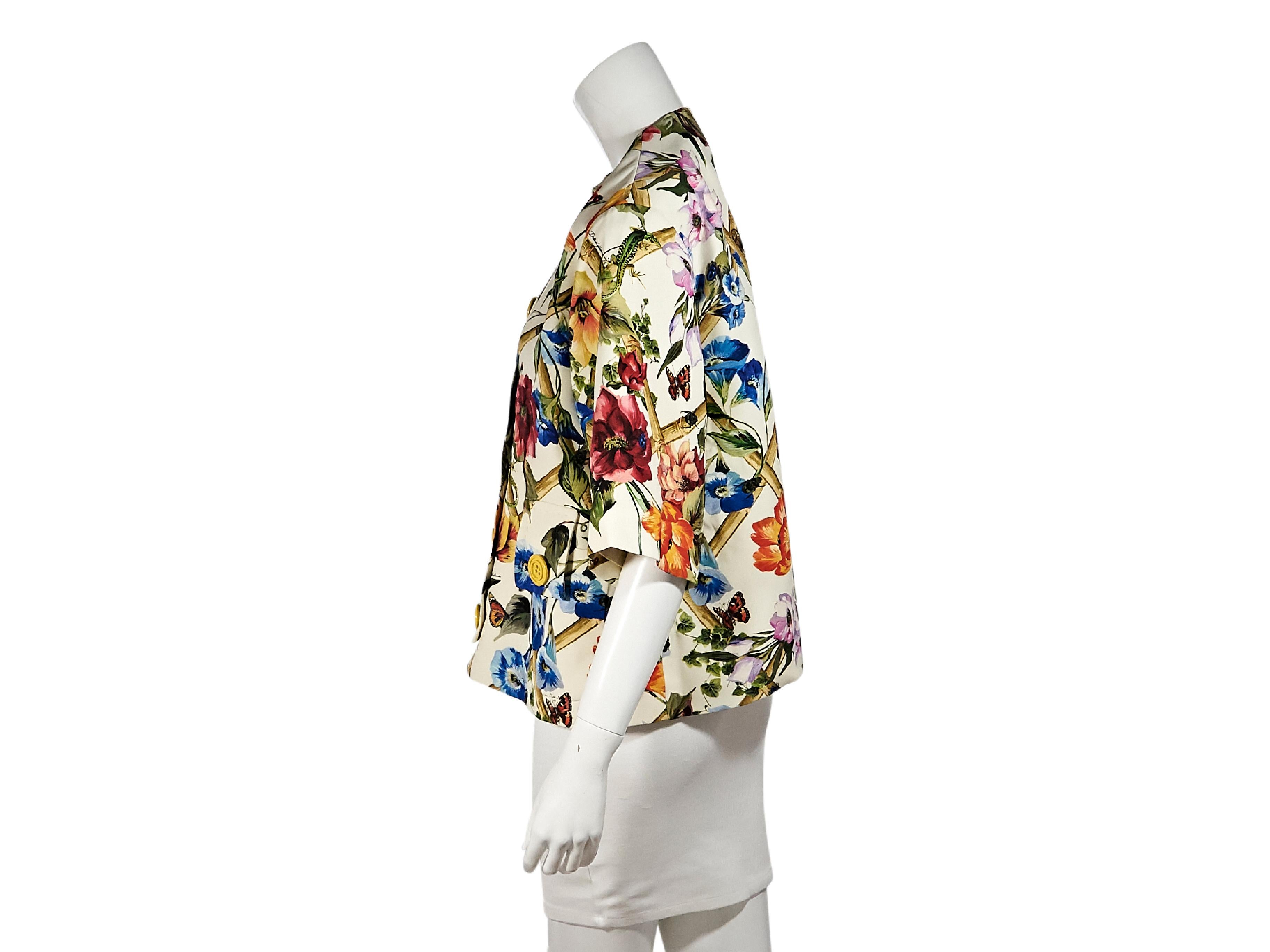 Product details:  Multicolor floral-printed stretch-wool jacket by Dolce & Gabbana.  Crewneck.  Elbow-length sleeves.  Snap-front closure.  Waist button-tab patch pockets.  35.5