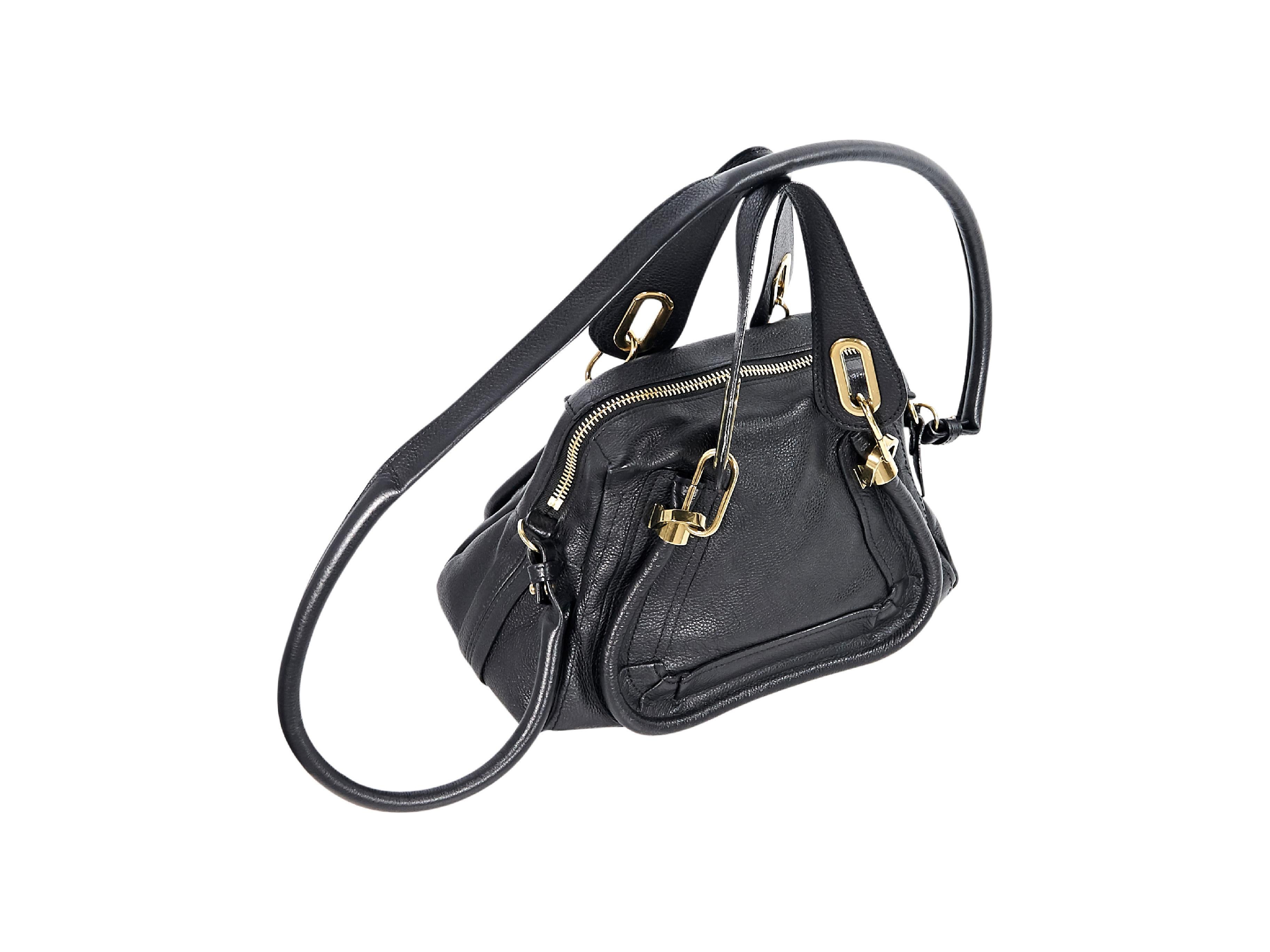 Product details:  Black leather Paraty satchel handbag by Chloe.  Dual carry handles.  Single crossbody strap.  Top zip closure.  Lined interior with inner zip and slide pockets.  Goldtone hardware.  9.25