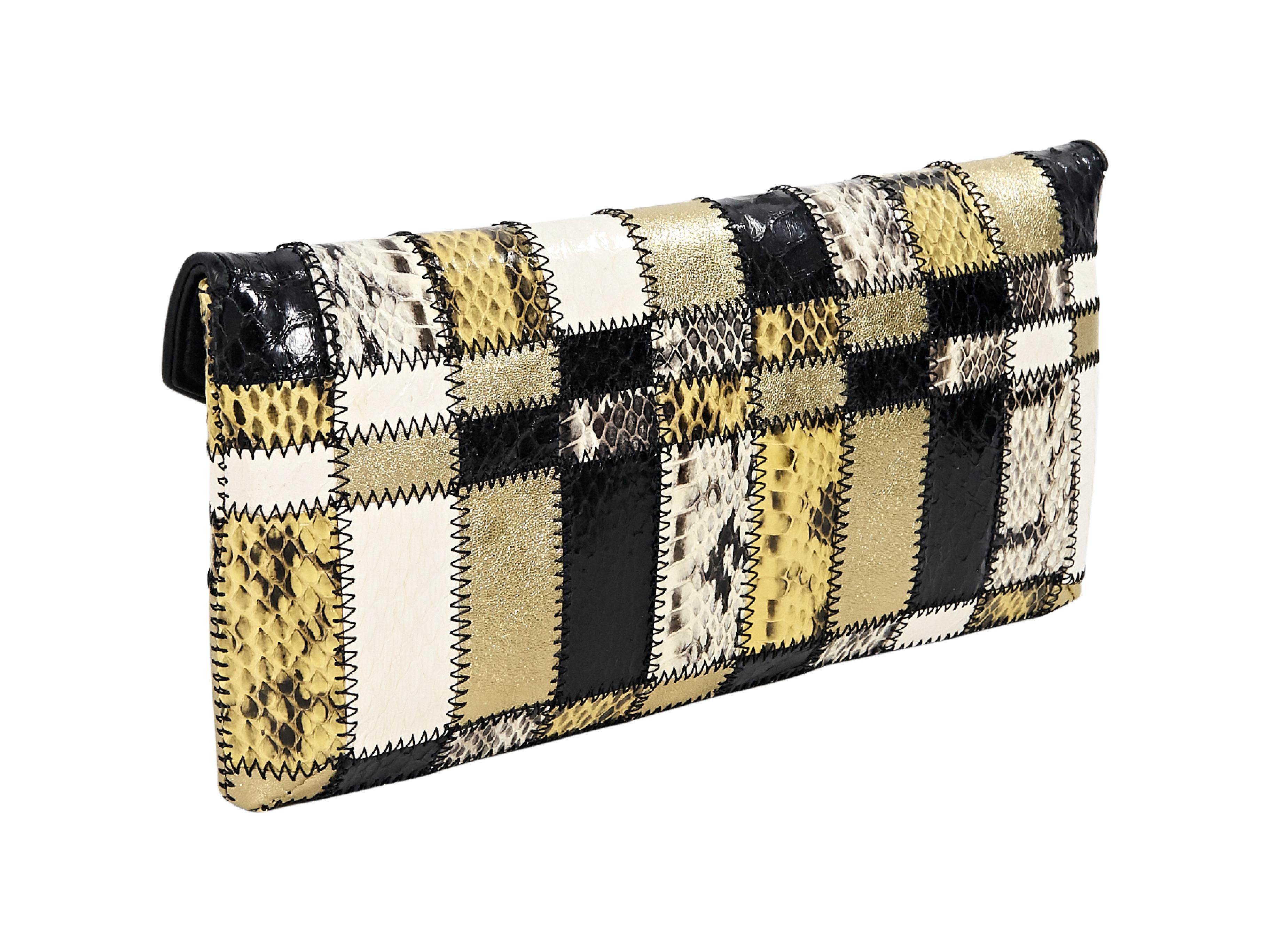 Product details: Multicolor patchwork snakeskin clutch by Tamara Mellon.  Front flap with clasp closure.  Lined interior with inner zip pocket. Goldtone hardware.  10.5