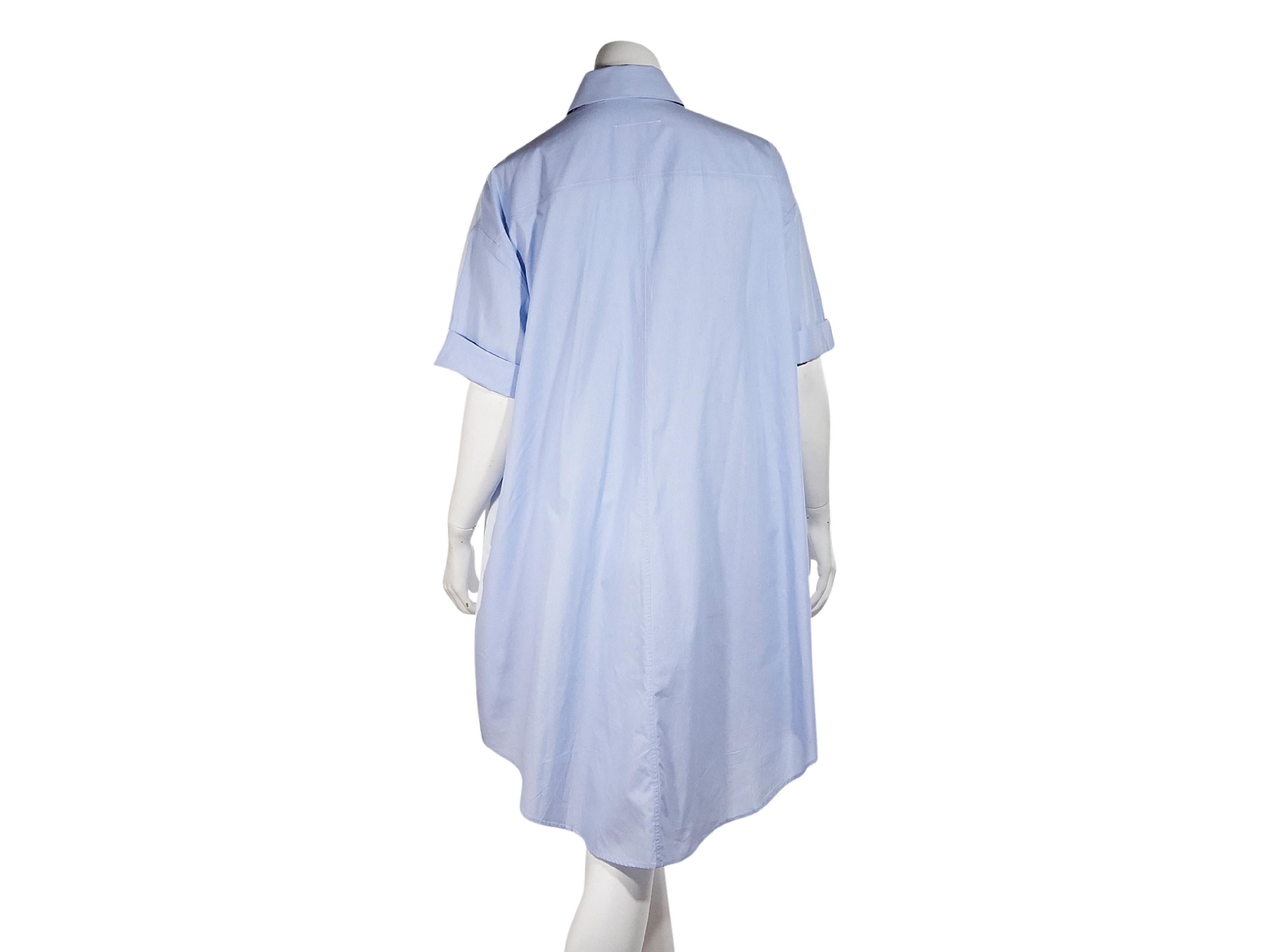 Product details:  Light blue oversized oxford shirtdress by MM6 Maison Margiela.  Point collar.  Short sleeves.  Button-front closure.  Shirttail hem.  32