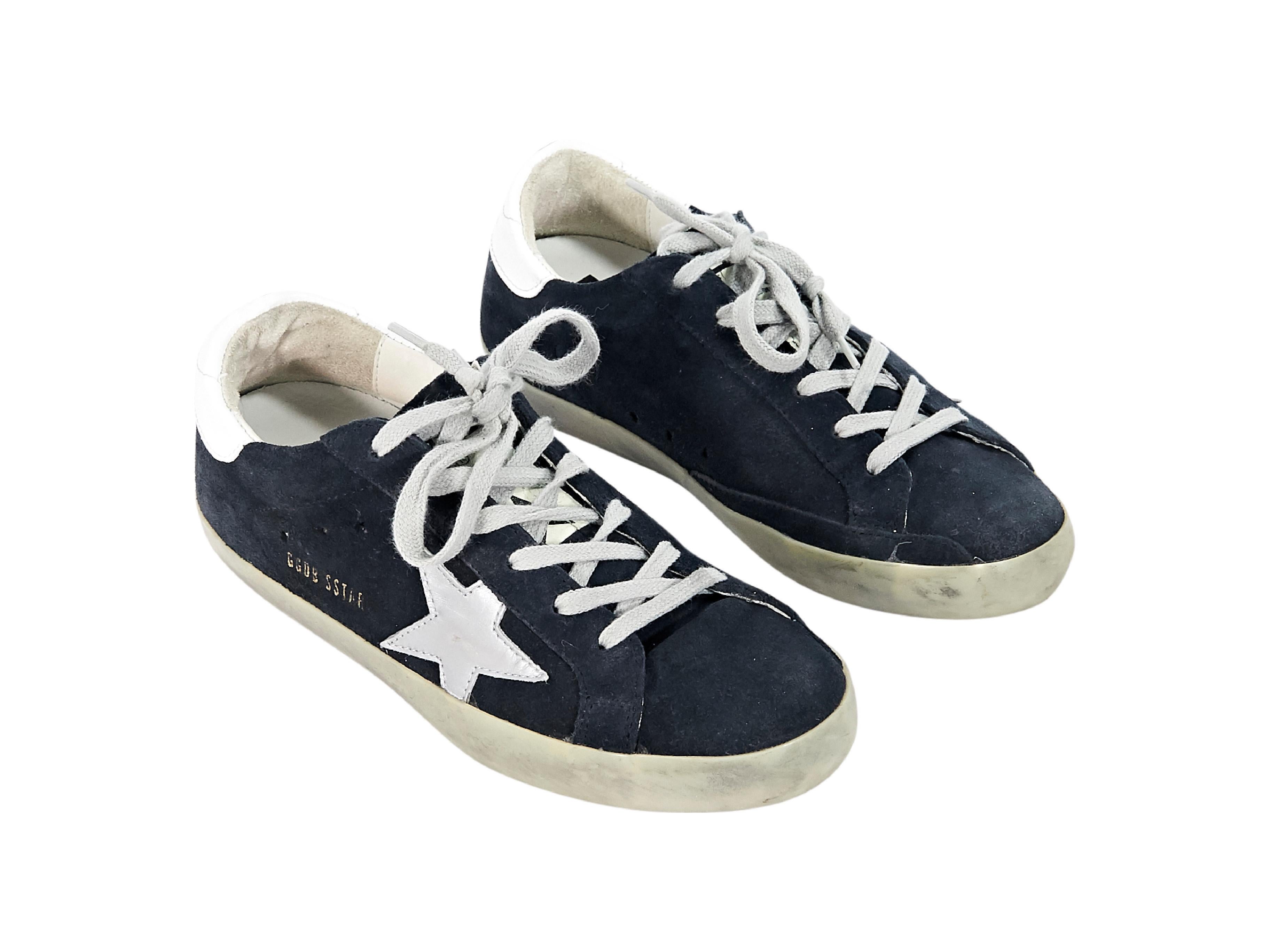 Product details:  Navy blue suede Superstar sneakers by Golden Goose Deluxe Brand.  Distressed design.  Lace-up closure.  Round toe.  
Condition: Pre-owned. Very good. 
Est. Retail $ 670.00