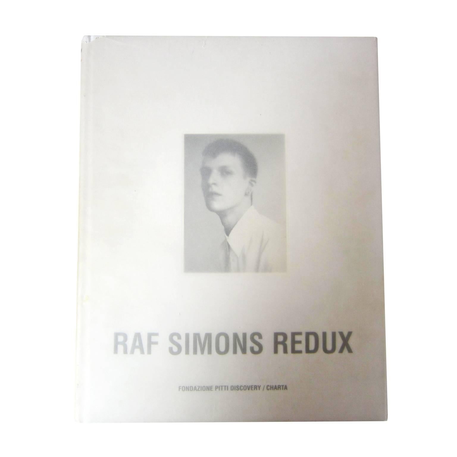 Raf Simons Redux - The book reveals Simons' social background, social isolation, social intimacy with his designers/models, and a blurry vision of the future.

Hardcover : 224 pages
Publisher : Fondazione Pitti Discovery / Edizioni Charta; 1st