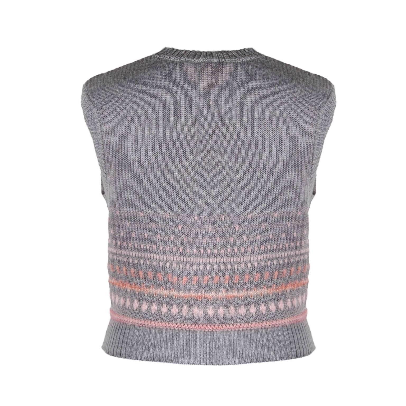 Courreges mohair knit vest from 60's. 
Light grey base, baby pink detailed knit with front button closure.
Fits like 36 EU, 4-6 US
Made in France.


