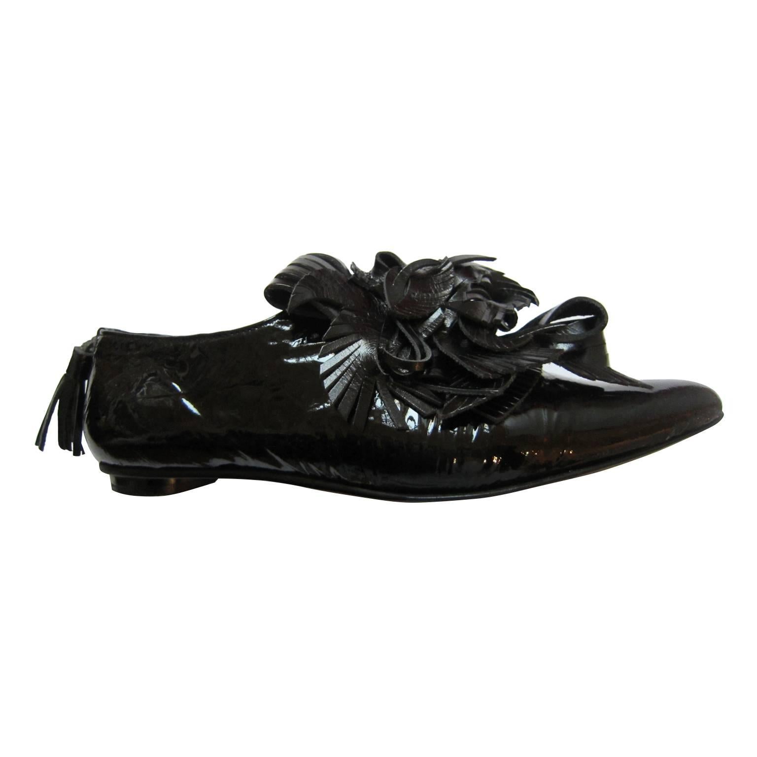 One of a kind Issey Miyake black patent leather flats with amazing leather crafts fringe detail tassel shoes from circa 90s. Abstract yet very calculated design.
Made in Japan. New in Box. 
Original size : 24 cm Japanese 
It fits like 7.5/ 8 US,