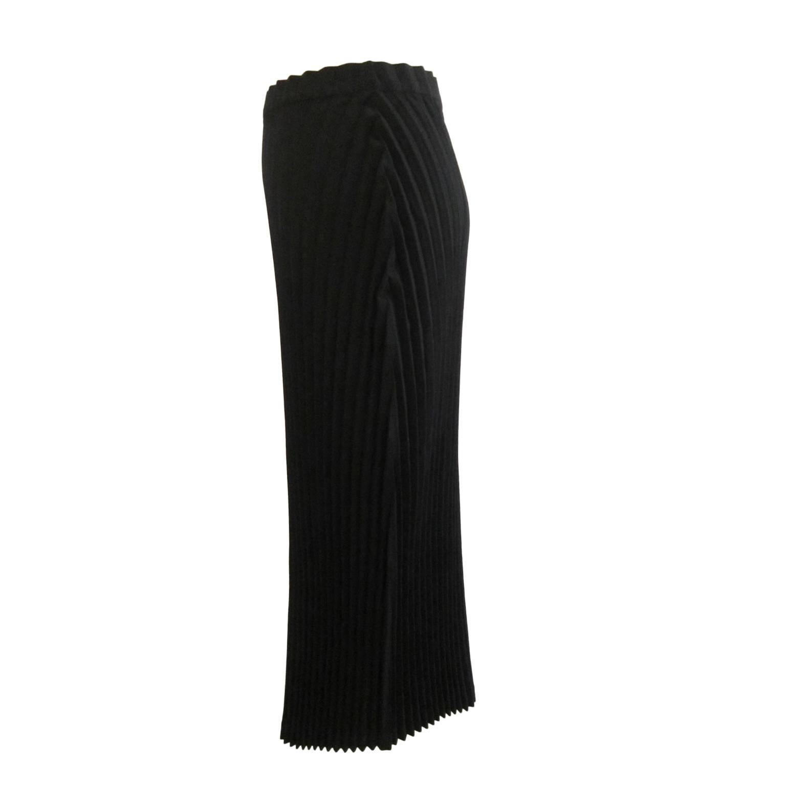 Issey Miyake pleated black long skirt from circa 90s. Beautifully constructed. Center back zip closure. 
Size : 2
Length :  89 cm 


