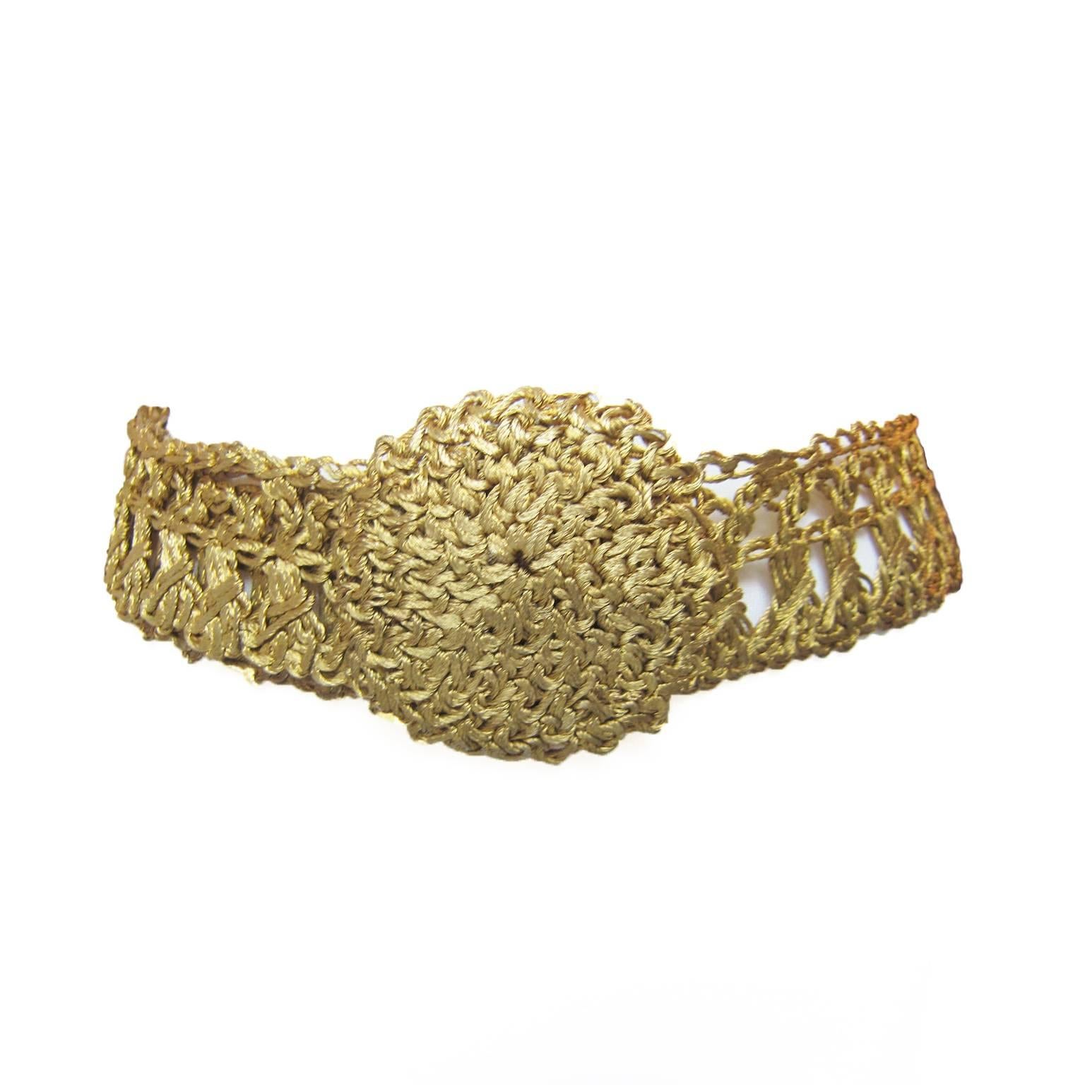 Unique golden metal wire hand crochet flattened belt from circa 1960s. With hook closure. 
Measurements :
Total length : 90 cm
Width : 4 cm
Circe motief : 8 cm

