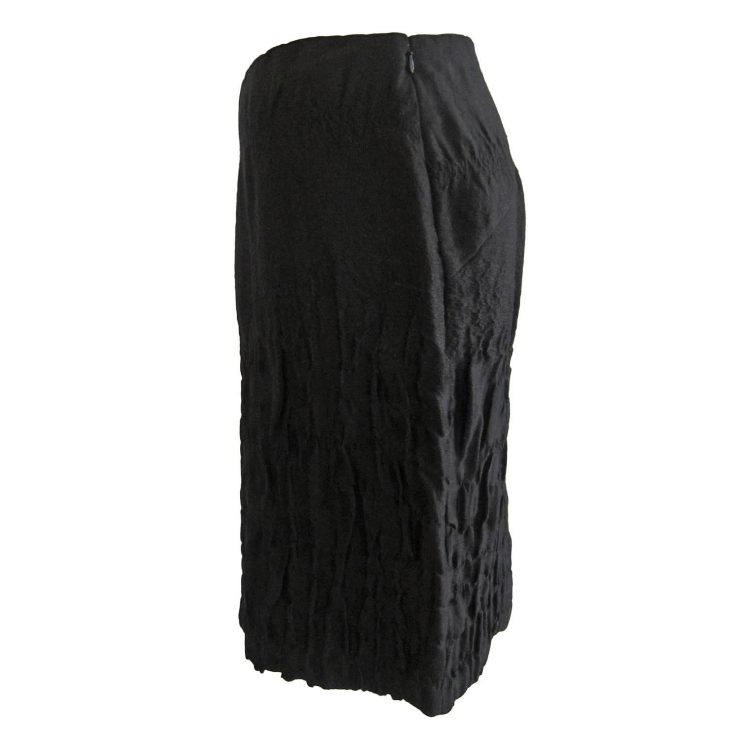 Elegant silk base black Prada pencil skirt is from collection AW 2007. Side blind zip closure.
Measurements : 
Original size : 40 IT 
waist : 76 cm
Length : 59 cm