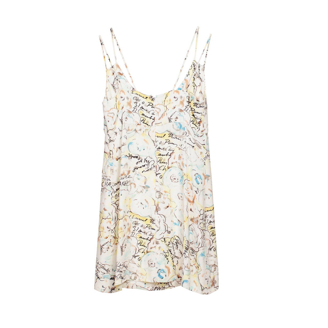 Iconic Karl Largerfeld's colourful hand drawing prints mini dress.
Double spaghetti shoulder straps with center back zipper with a Chanel logo button closure. Surface of material has partly applique technic which give charming three dimensions on