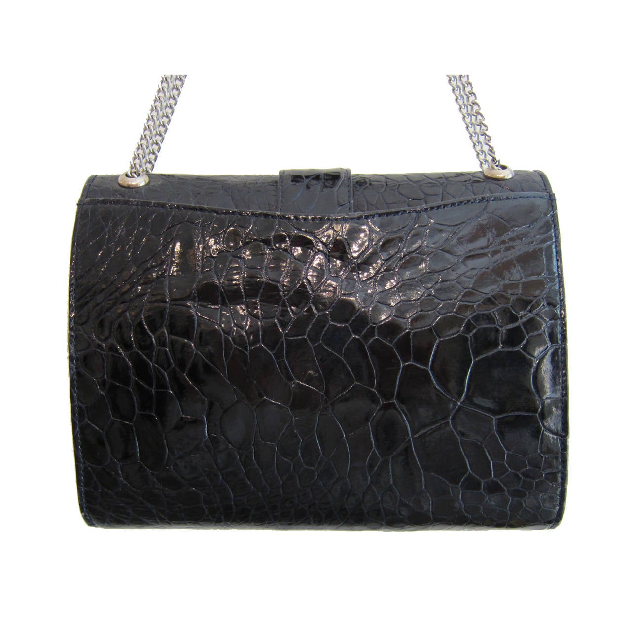 Rare vintage Crocodile handbag circa 1960's in deep navy black. 
It has adjustable double shoulder chain strap with excellent workmanship silver metal closure. 
15 x 20 x 4cm, Double chain 44 cm, Single chain 72cm