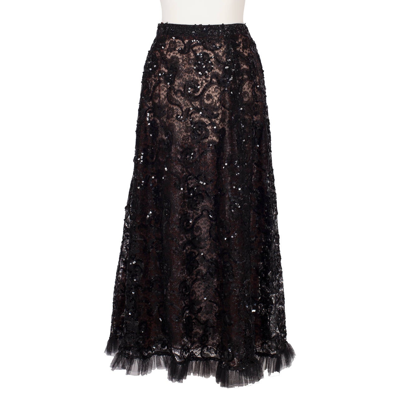 Yves Saint Laurent ensemble from 70's. French floral patterned black lace with sequins with three dimensional embroideries. 
Skirt has beige lining, oversized top closes with hooks.
French size 38
Skirt:
waist: 64 cm
Length: 90