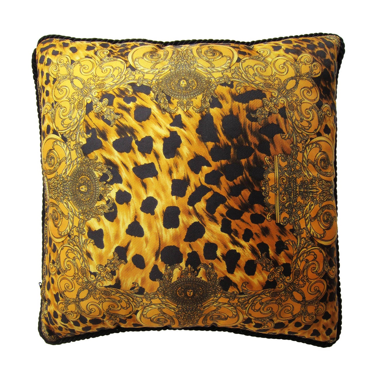 Atelier Versace silk pillow. 
Golden brown base leopard silk prints, with contrasted black rope edge. 
40 cm x 40 cm