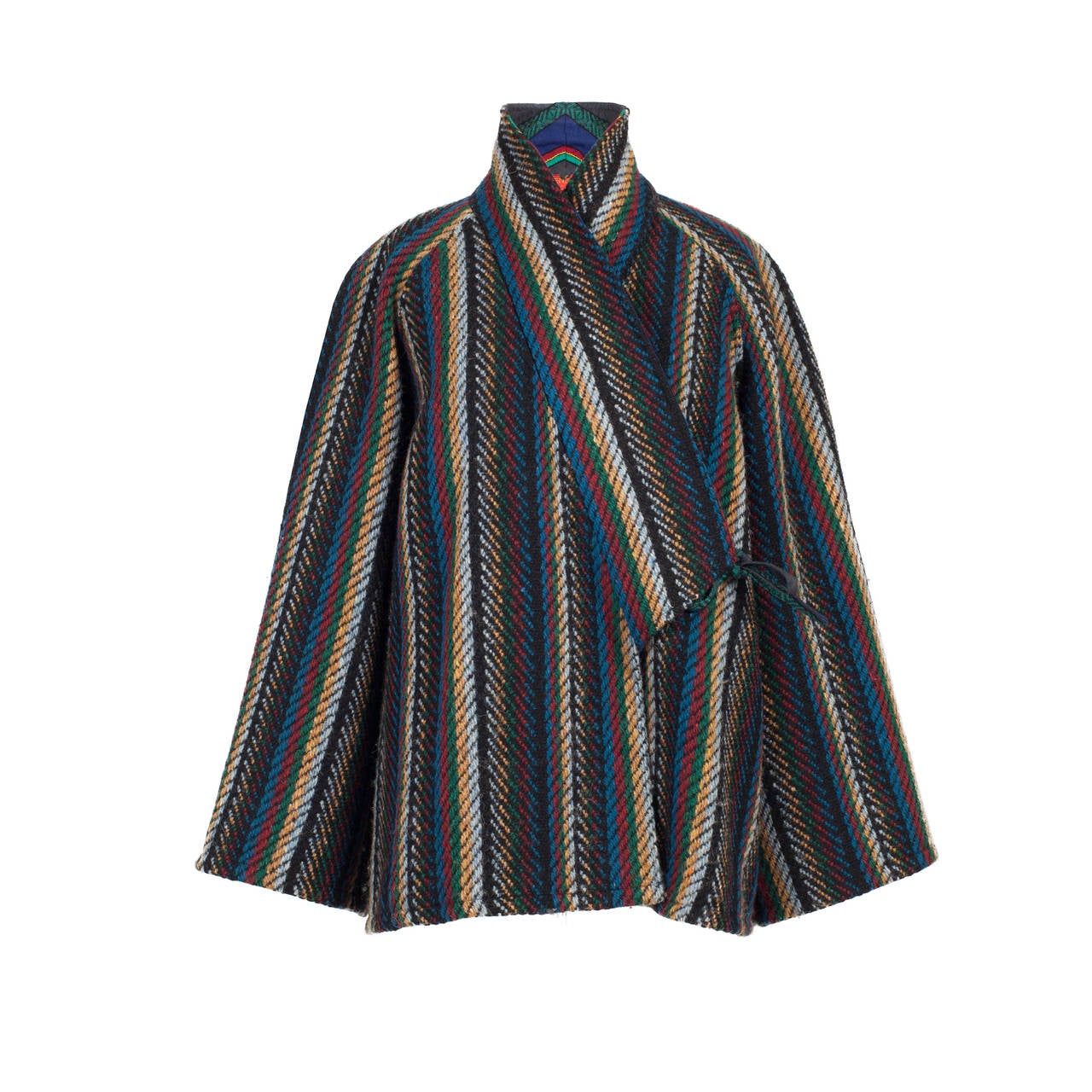 Kenzo iconic stripe coat from early 1980's. Kimono sleeve, multi colour over sized tweeds. 100% wool lining 100% acetate
Size :  EU 38 ( US 6 - 8)
Measurements : 
Shoulders -  approx. 50 cm
sleeves length - approx. 60 cm
sleeves width -  approx