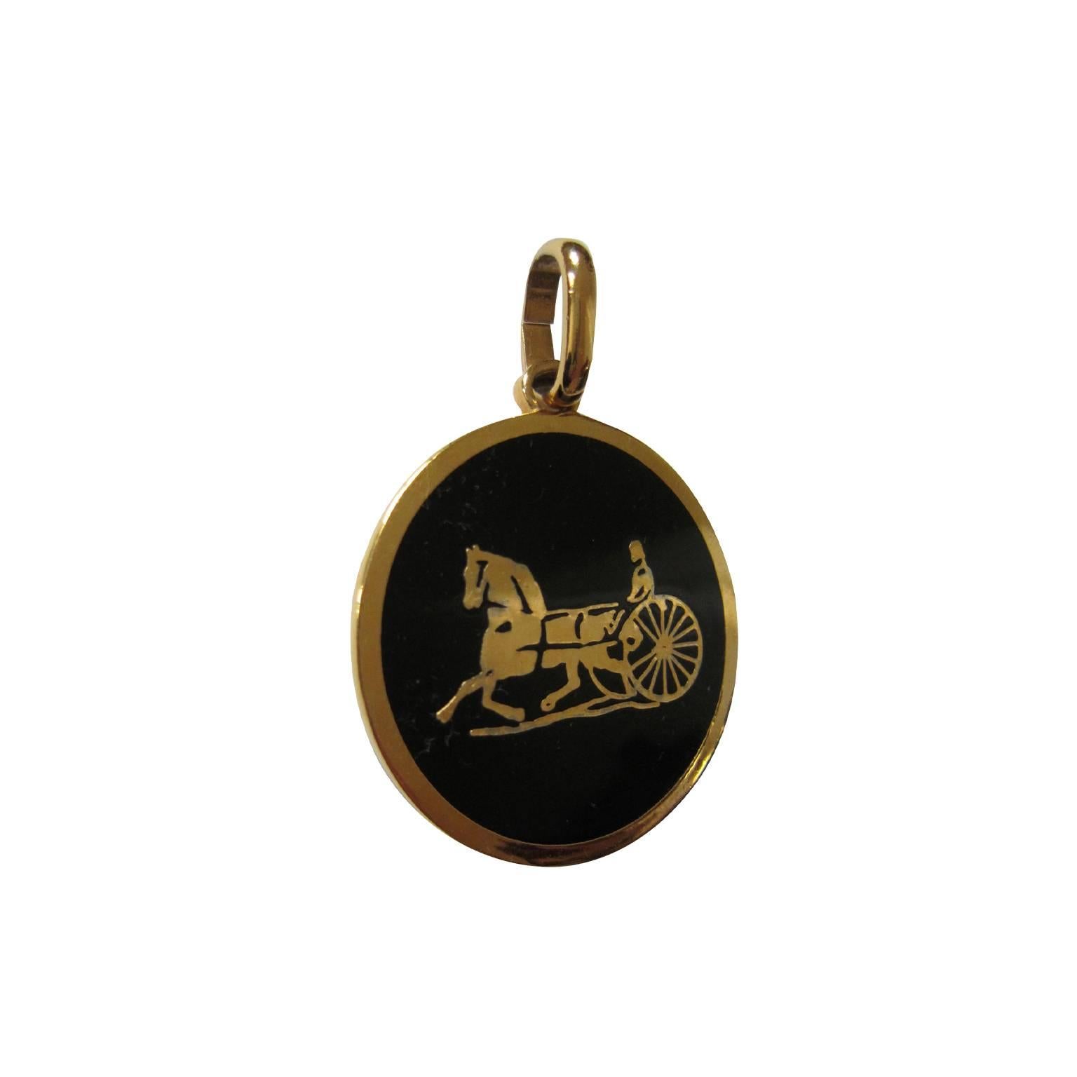 Celine medallion from circa 1970s, iconic horse carriage motief in black & gold. 
Gold logo embossed.
Measurements : 5 x 5 cm 