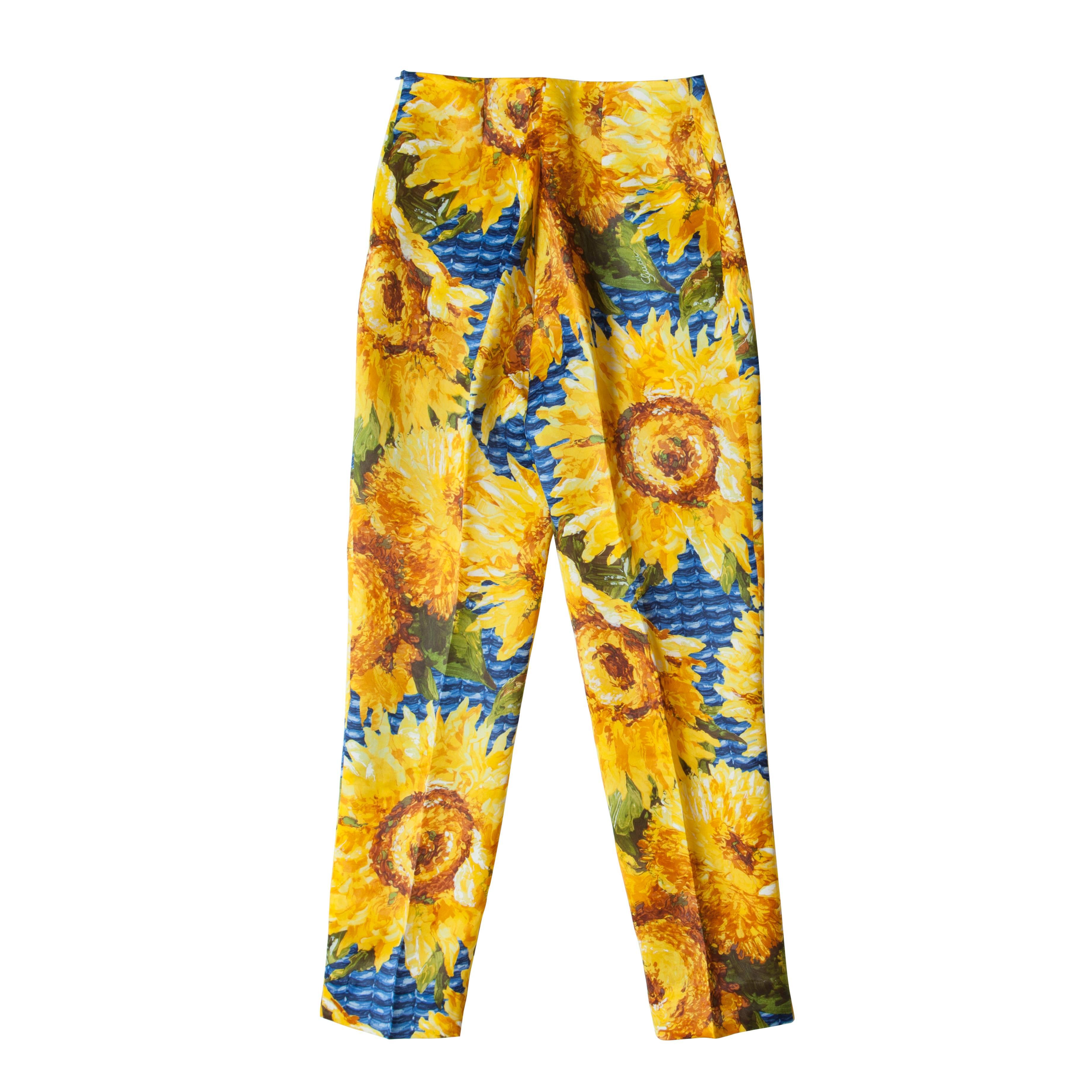 Gucci silk trousers feature a hand-painted bright sunflower print and an elegant cropped leg, center pressed.  Made in Italy. 
Material: 100% Silk.
Size : 42 Italian (It fits like 38EU, 6-8US)
Measurements : 
Waist : 32 cm
Length : 95 cm
Width
