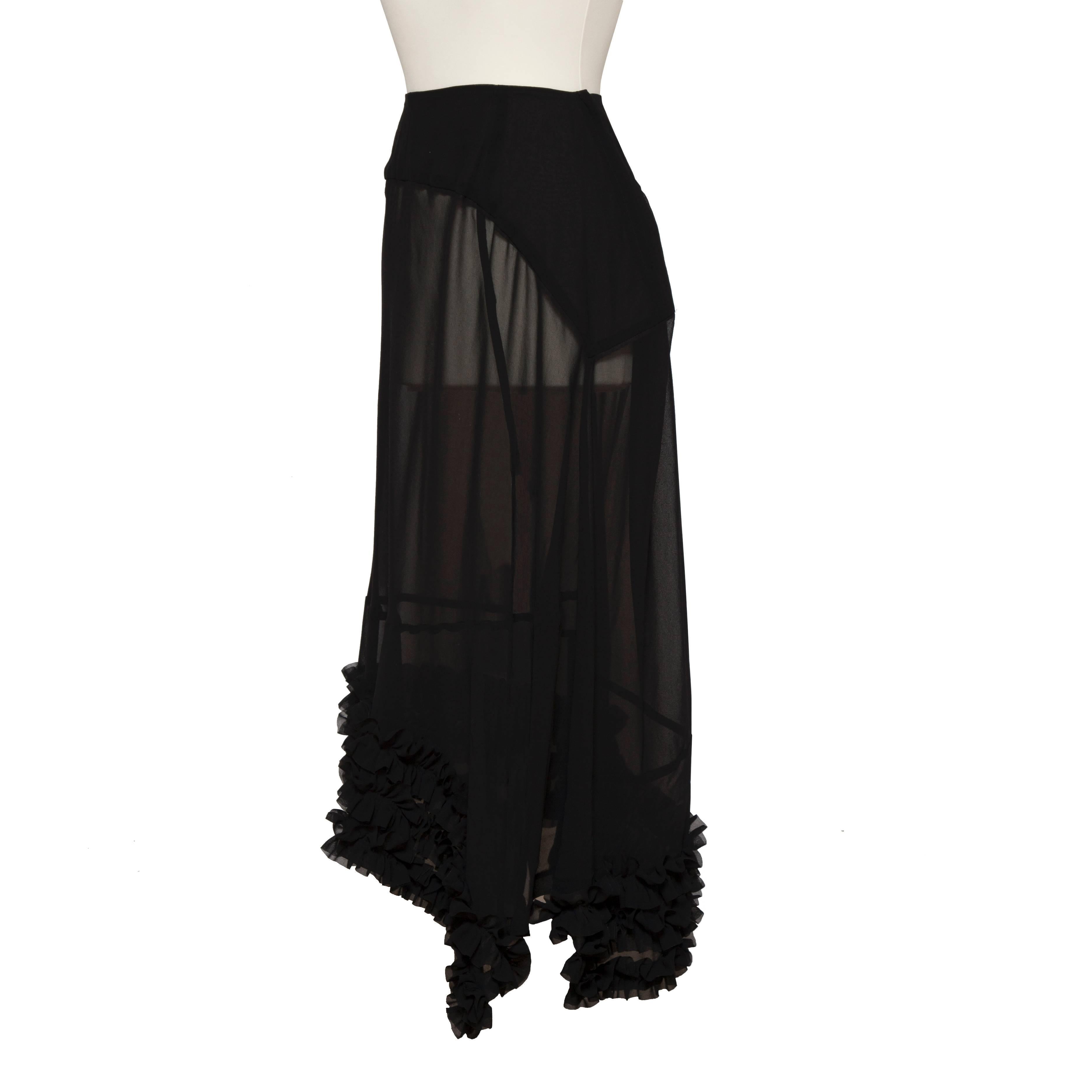 Comme des Garcons black sheer skirt. Ruffle edge detail gives extra heaviness in balance and movement - Beautifully cut. 
Measurements :
Waist : 68 cm
Total length : Approx. 92 cm