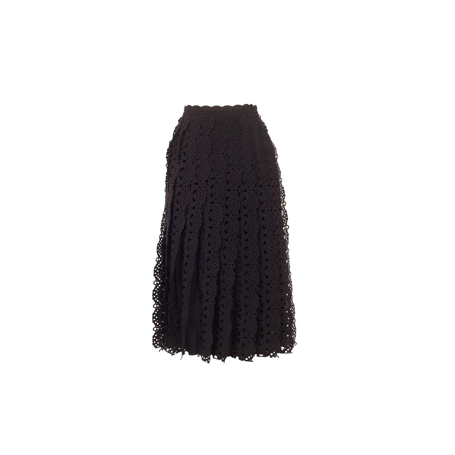 Unique Issey Miyake pleated skirt from 90's. 
Individual cut out lace tape sawn in to each pleats make beautiful movement.

Material : 100% polyester 
Measurements : 
Length 73 cm
Waist 72 cm 
