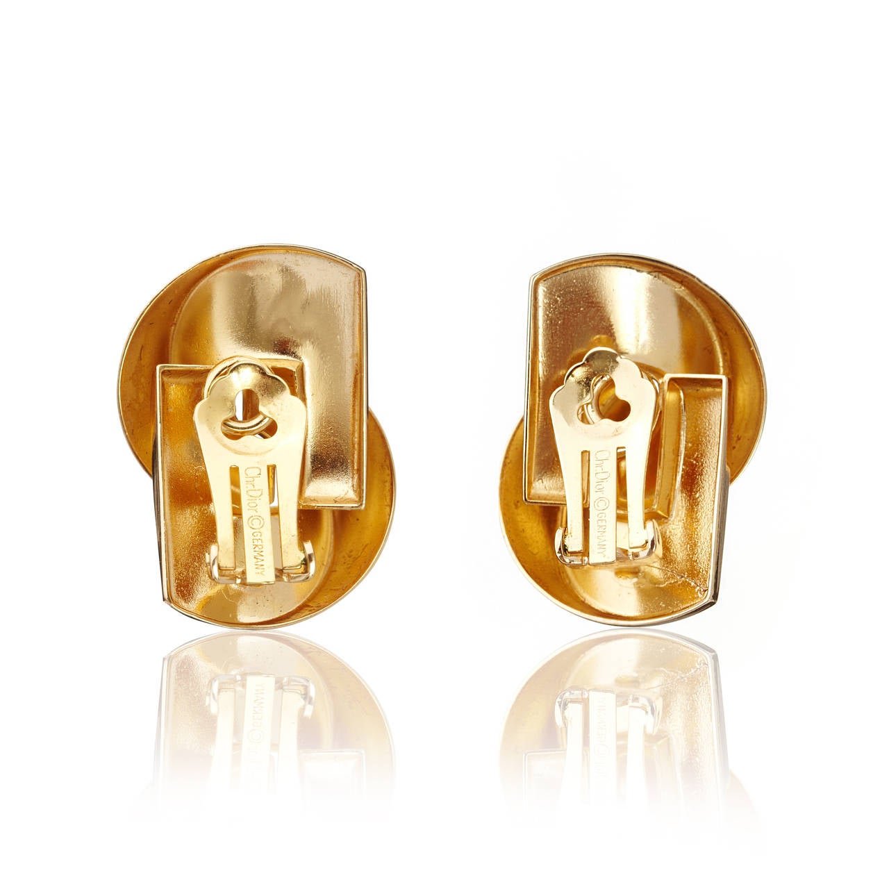 A striking pair of very sculptural 1980′s Dior clip on earrings, in their popular love knot design.
The earrings are gold tone and measure 3.5 x 2cm.
Marked: Chr.Dior (C) Germany

About the Designer:
Christian Dior 1905-1957
French fashion