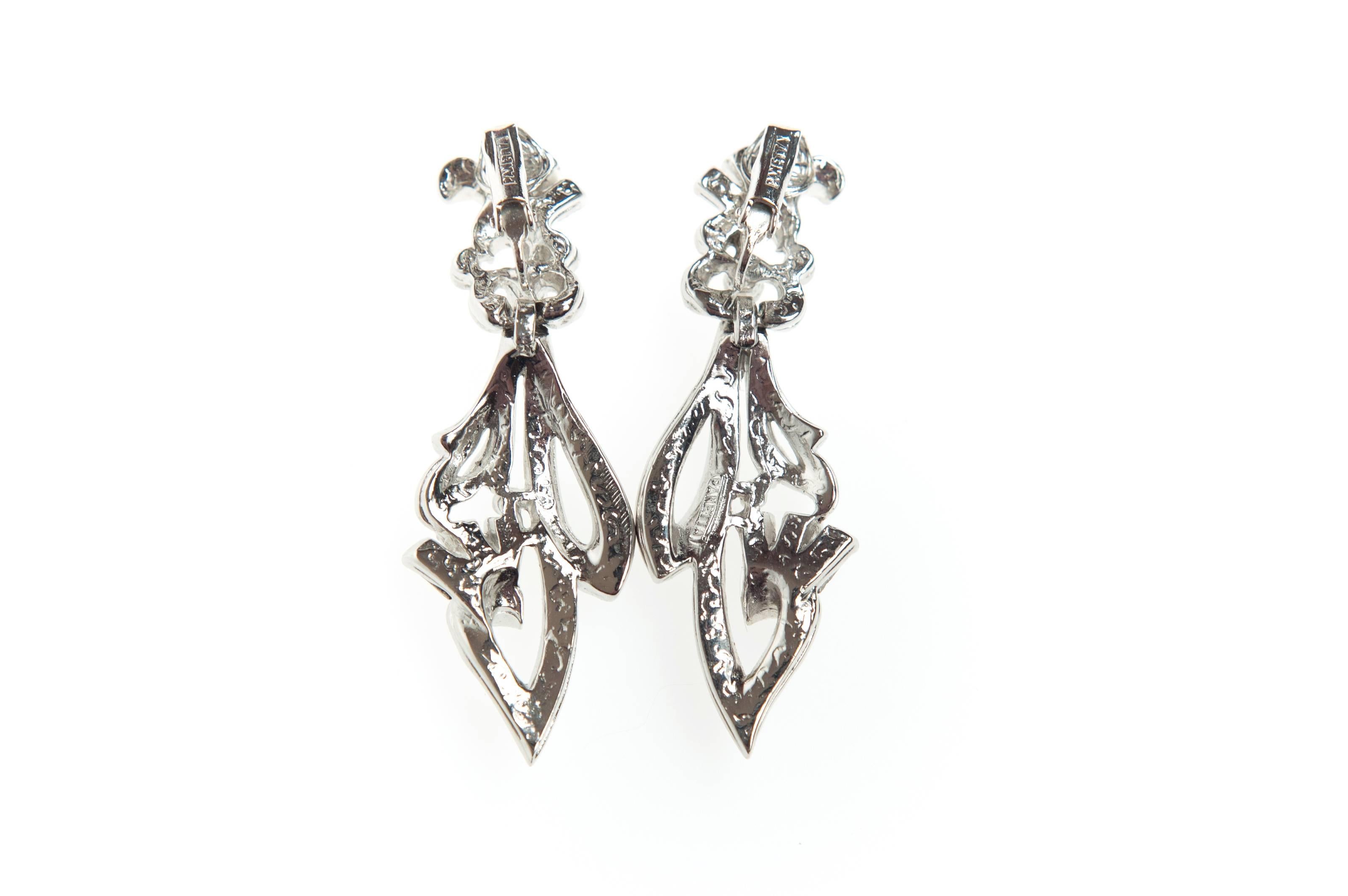 Beautiful Vintage Rhodium plated rhinestone clip on pendant earrings by Panetta.
They are pave set with crystal clear rhinestones and have textured backs, reminiscent of fine jewellery.
Marked: Panetta

About the Designer:
Panetta 1945 -