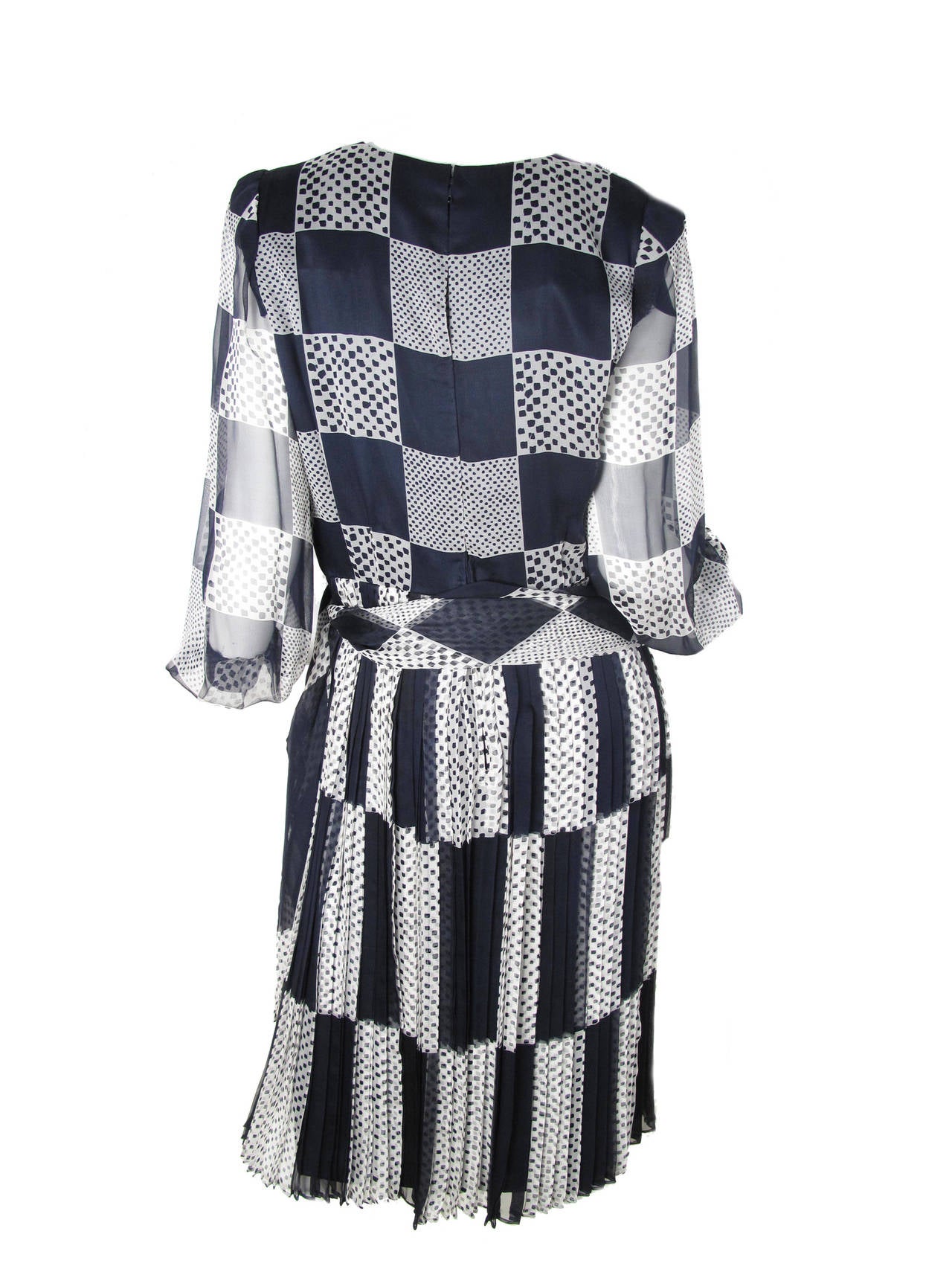 1980s Andre Laug black and white silk chiffon dress with scarf belt. Polka dot print and check. Condition: Sheer sleeves, pleated skirt. Excellent. Size 12

38