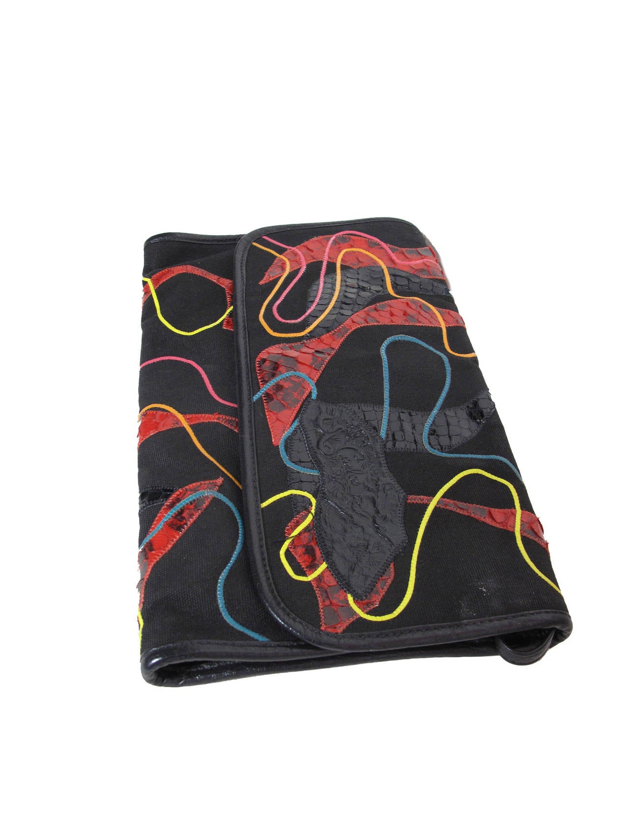 Carlos Falchi black canvas clutch/shoulder bag with snakeskin appliqués. Condition: Excellent. 11 1/2