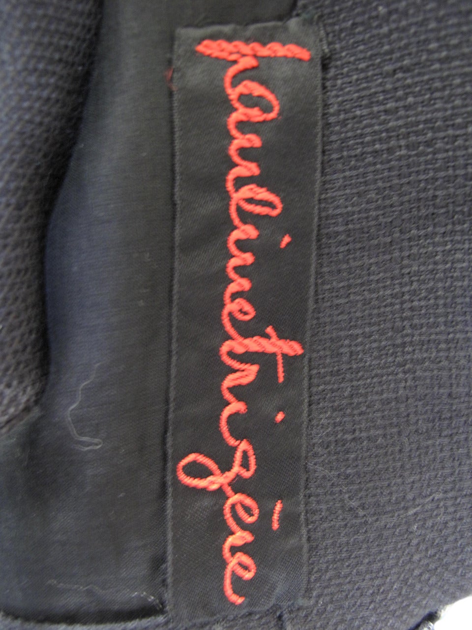 Pauline Trigere black linen dress with large pockets and buttons. Condition: Good, discoloration from age.  36