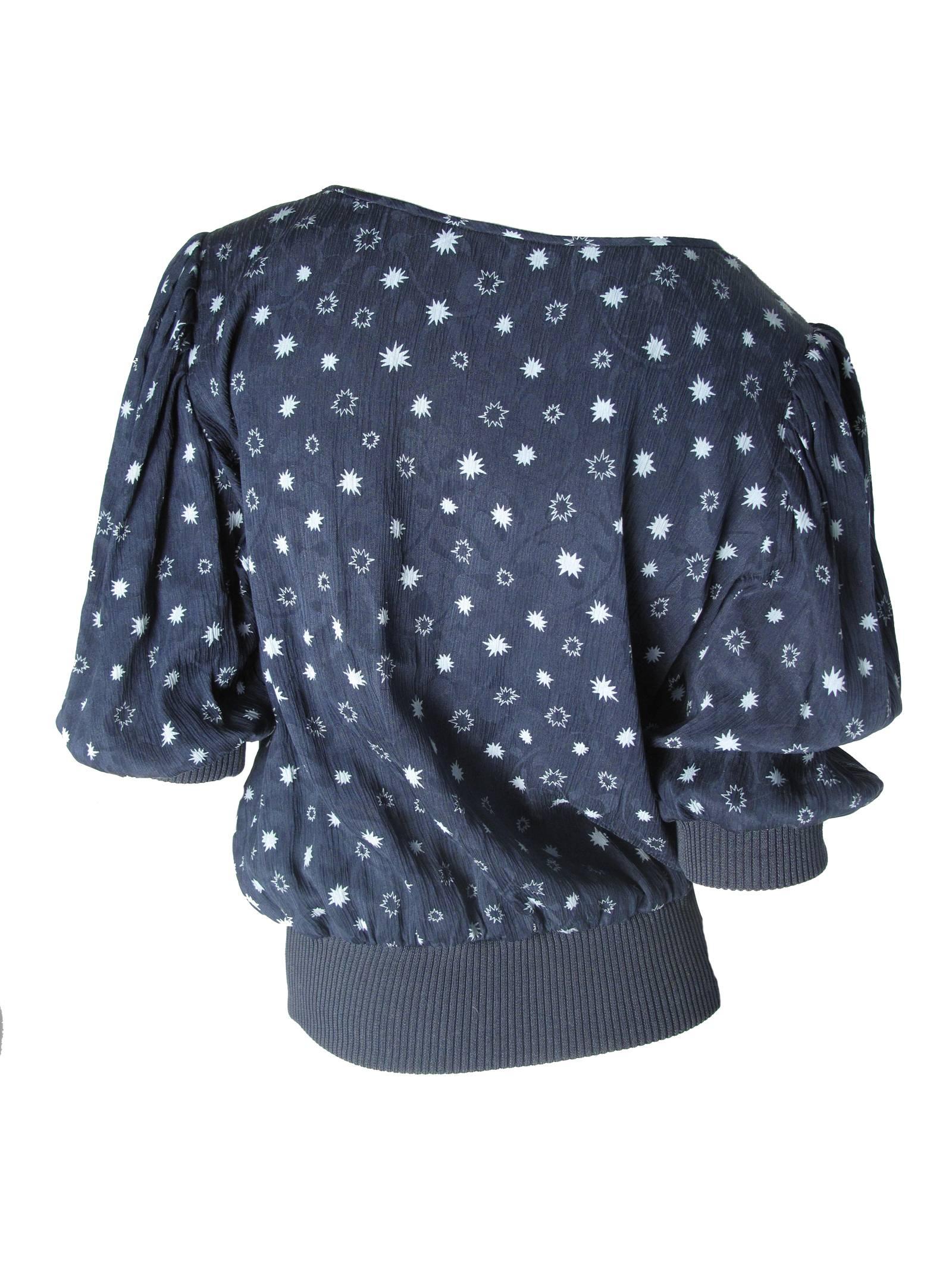 Ungaro silk crepe navy top with star print and elastic waist and cuffs.   Condition: Excellent. Size L

41