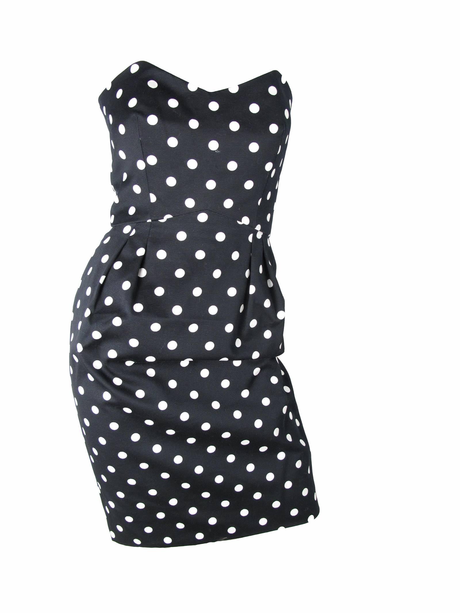 Guy Laroche black and white cotton strapless polka dot dress. Too small for mannequin, did not zip all the way up, see photos. Size 36/ current US 4 

We accept returns for refund, please see our terms.  We offer free ground shipping within the