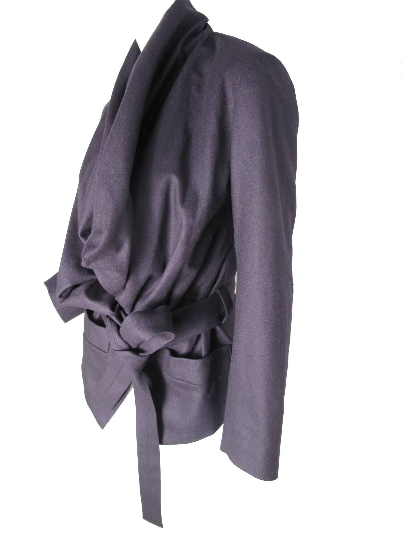 Vivienne Westwood Anglomania deep purple felt ( wool/ cashmere blend) jacket with tie at waist. Two front pockets, interesting neckline details.  Condition: Excellent.  Size 44 / US 8 

We accept returns for refund, please see our terms.  We offer