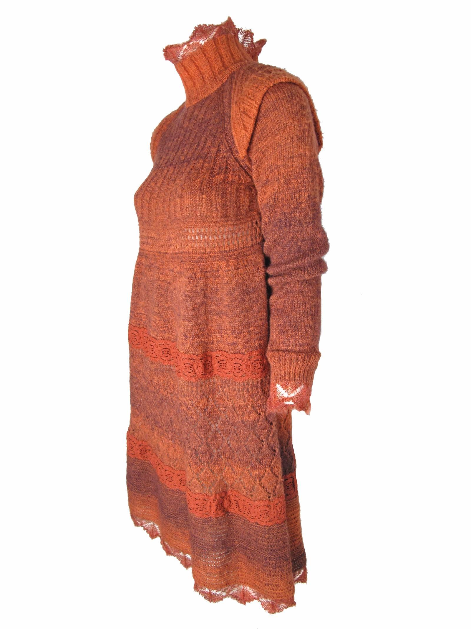 1990s Jean Paul Gaultier rust knit sweater dress with lace.  Interesting shoulder detail.  Condition: Excellent. Size XS

We accept returns for refund, please see our terms.  We offer free ground shipping within the US.  Let us know if you have