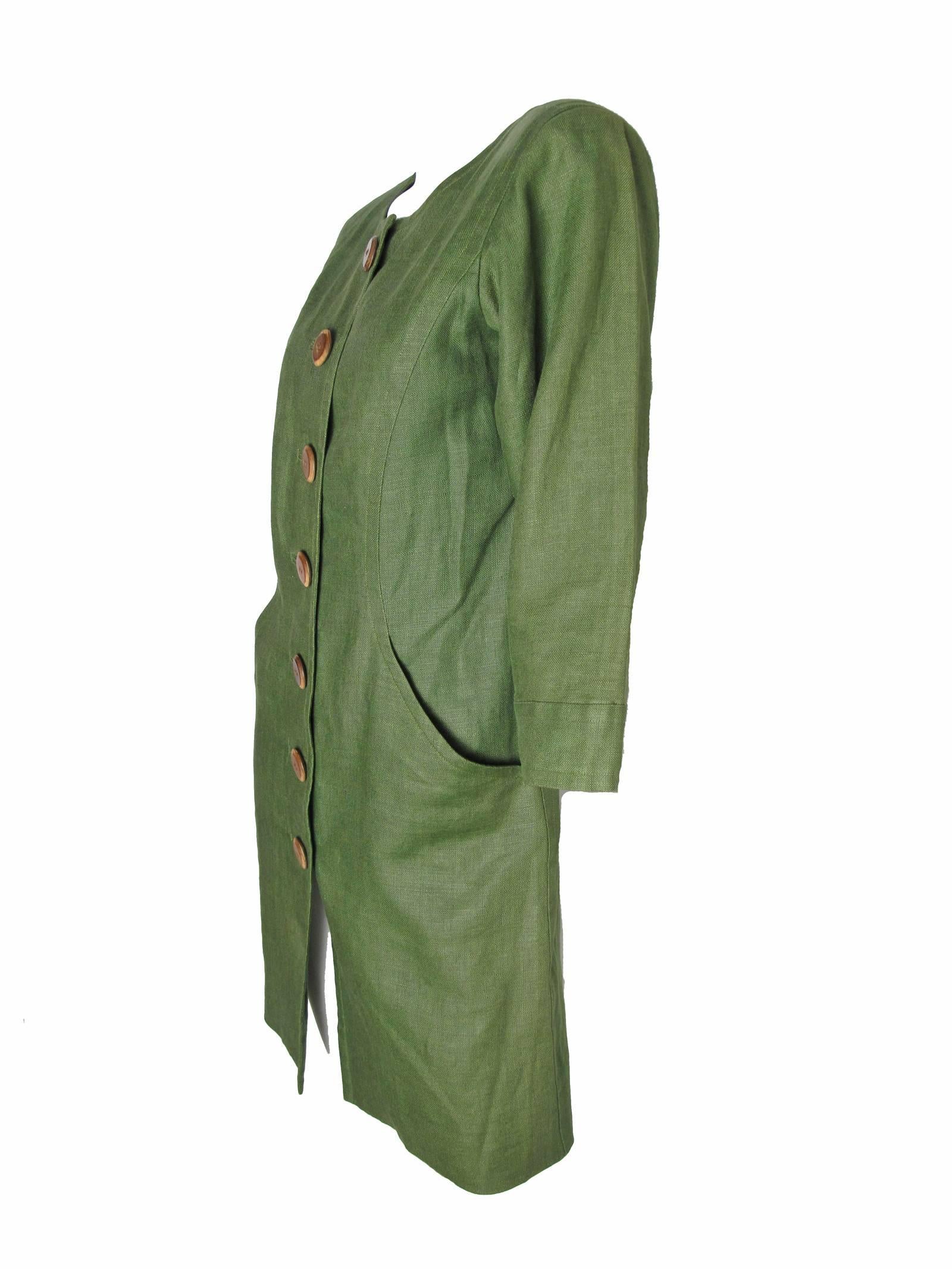 Yves Saint Laurent green linen dress, buttons down front.  Two side pockets.  Condition: Excellent. Size 34 / or current US 6 / 8
36" bust, 33" waist, 19"  sleeve, 37" hips, 36" length. 

We accept returns for refund, please