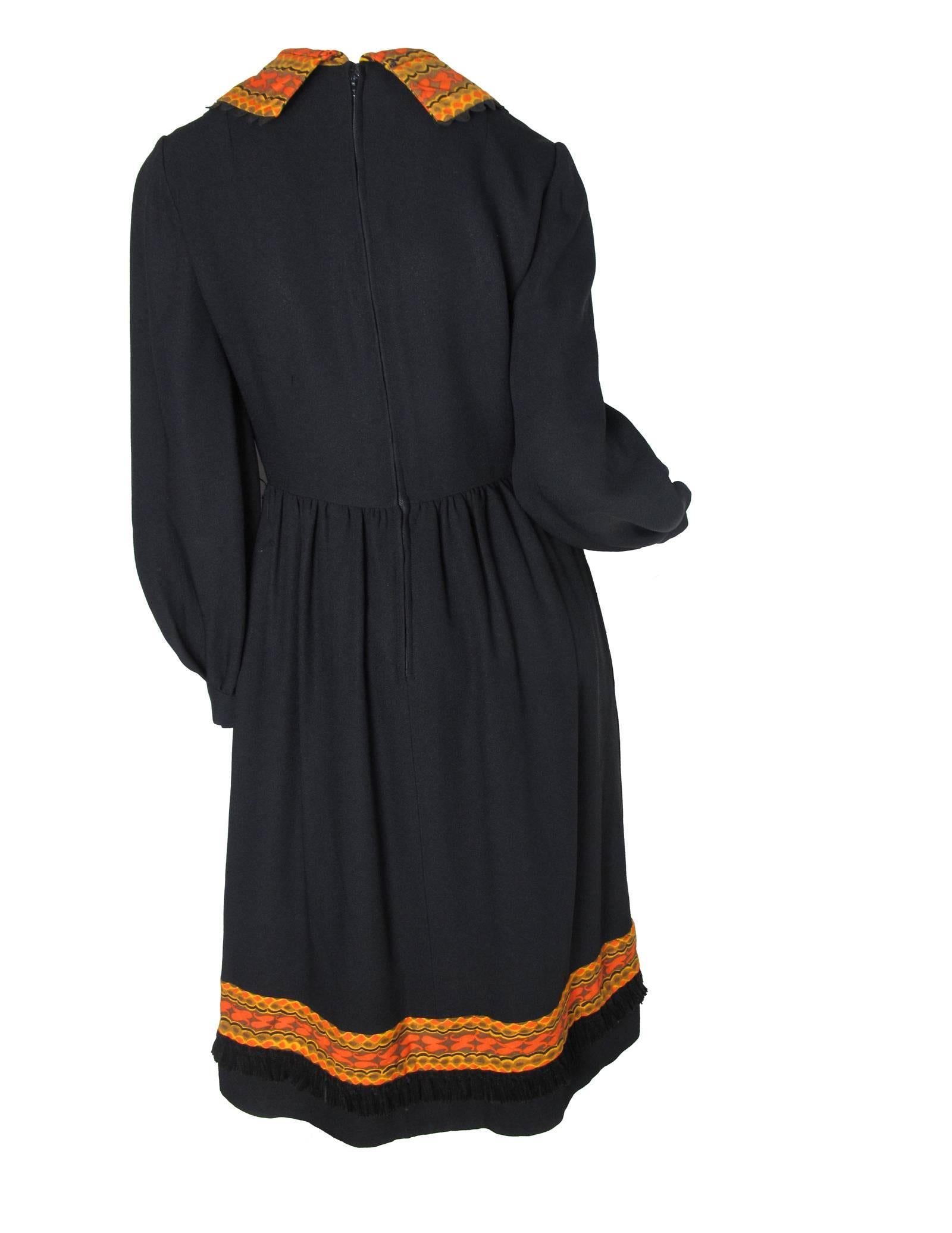 1960s Oscar de la Renta black crepe dress with orange collar and velvet tassle trim. Side pockets. Condition: Very good. Size Large
34