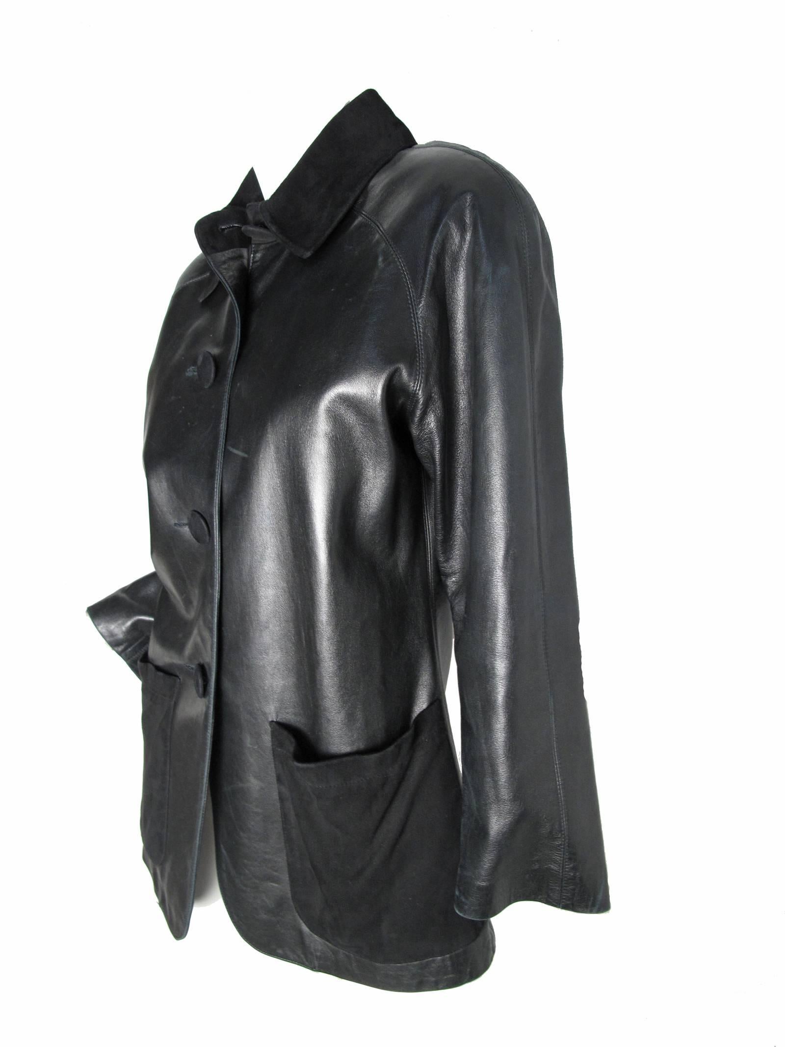 Yves Saint Laurent black leather jacket with suede collar and pockets.  Size 36 
Condition: Good, some all over wear.
38