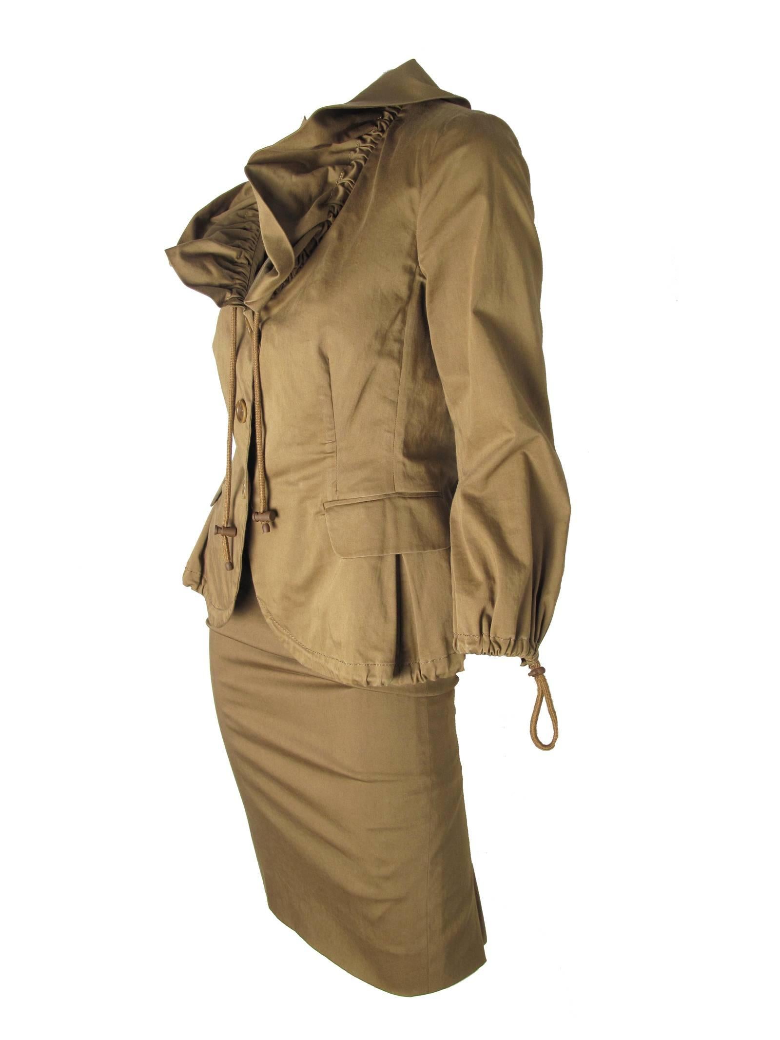 Moschino Cheap & Chic brown cotton skirt suit with ruffled collar jacket, drawstrings at collar,  cuffs, and hem.  Two front pockets, buttons down front. Size US 4, France 34, Italy 38

Skirt: 27
