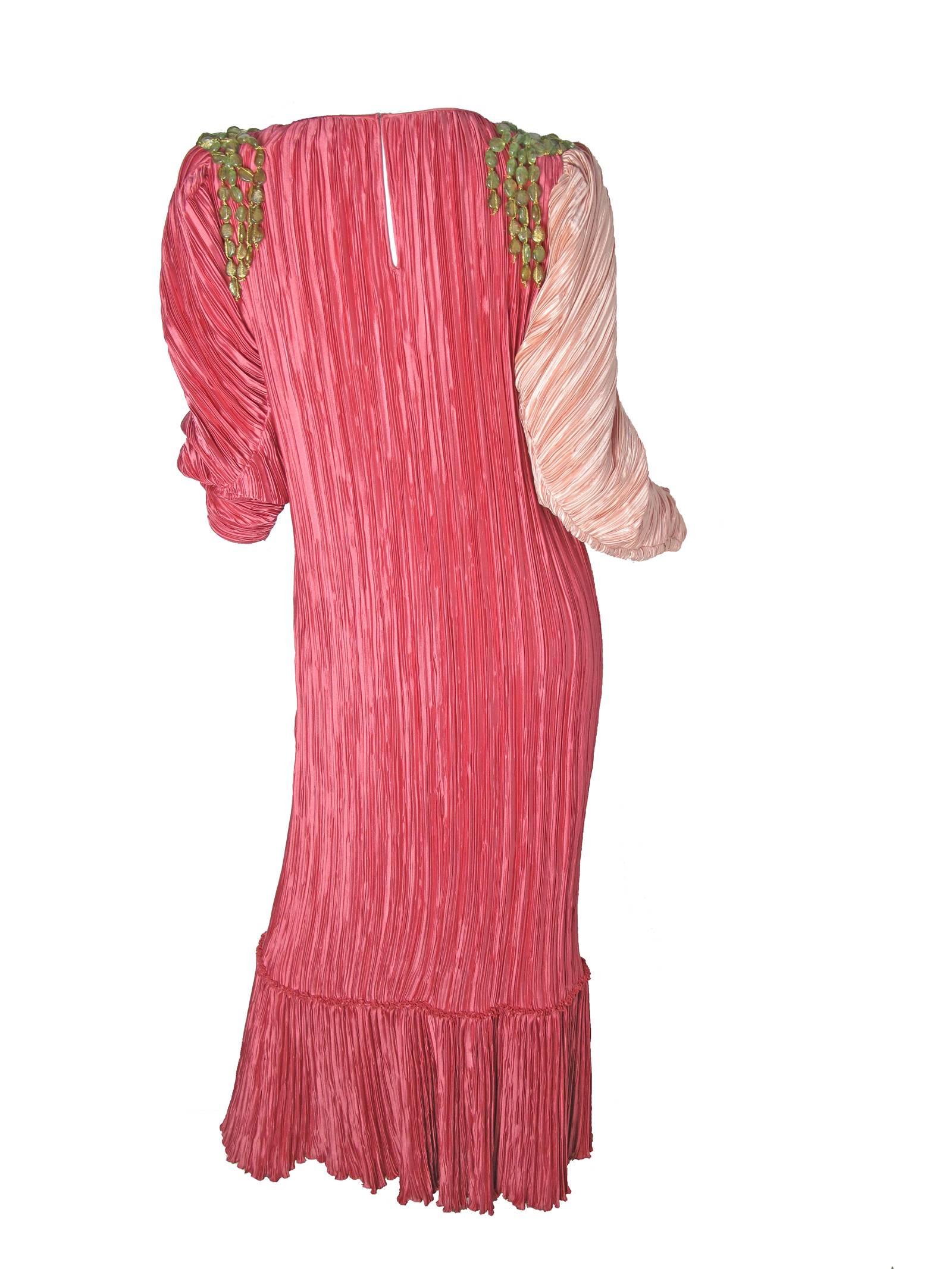 Mary McFadden pink pleated gown with green stones on shoulders.  Condition: Excellent. Size Large

42