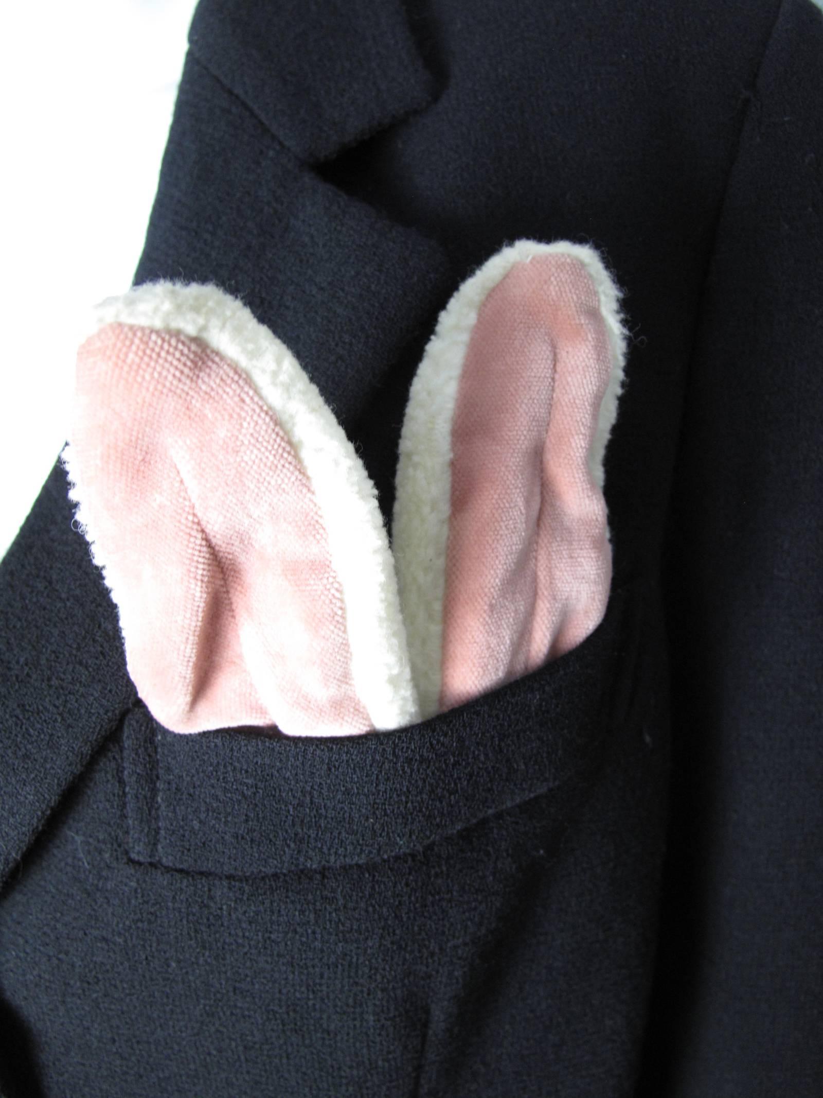 Moschino black wool blazer with rabbit ears in the pocket and fluffy tail on back.  Condition: Very good.  labeled Size 12 ( mannequin is a size 6 ) 
40