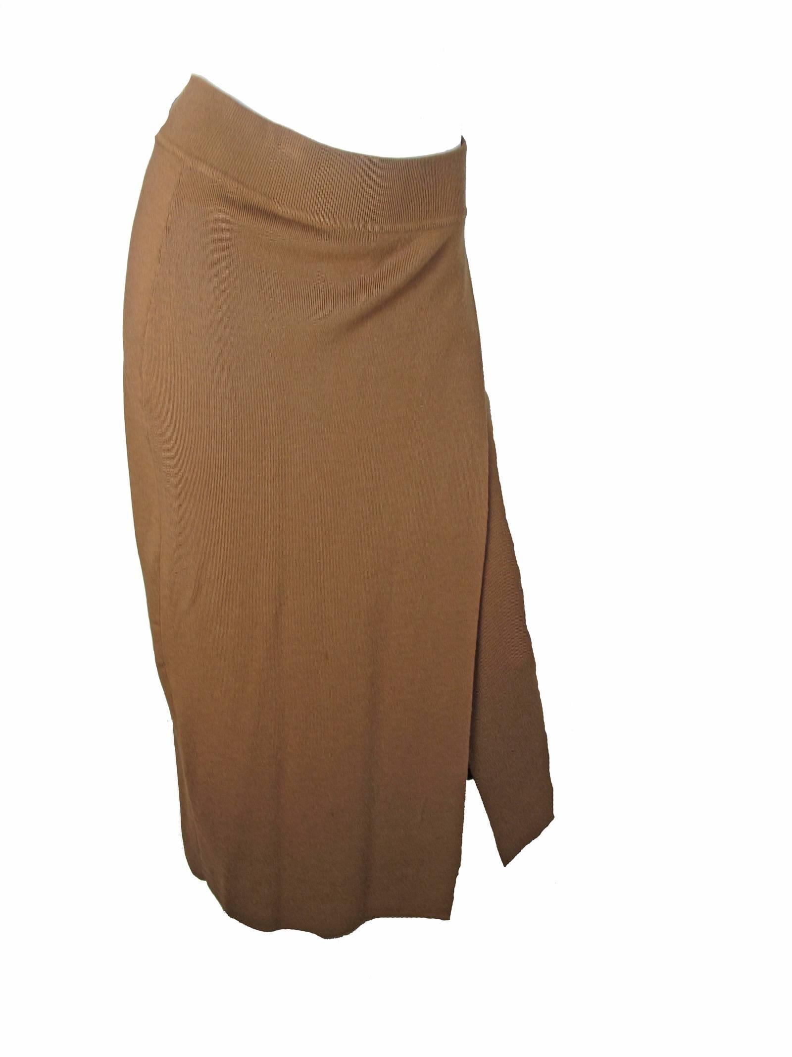 Donna Karan for Anne Klein 1980s brown knit oversized cardigan and skirt.  Size Medium.  Condition: Excellent. 

We accept returns for refund, please see our terms.  We offer free ground shipping within the US.  Please let us know if you have any