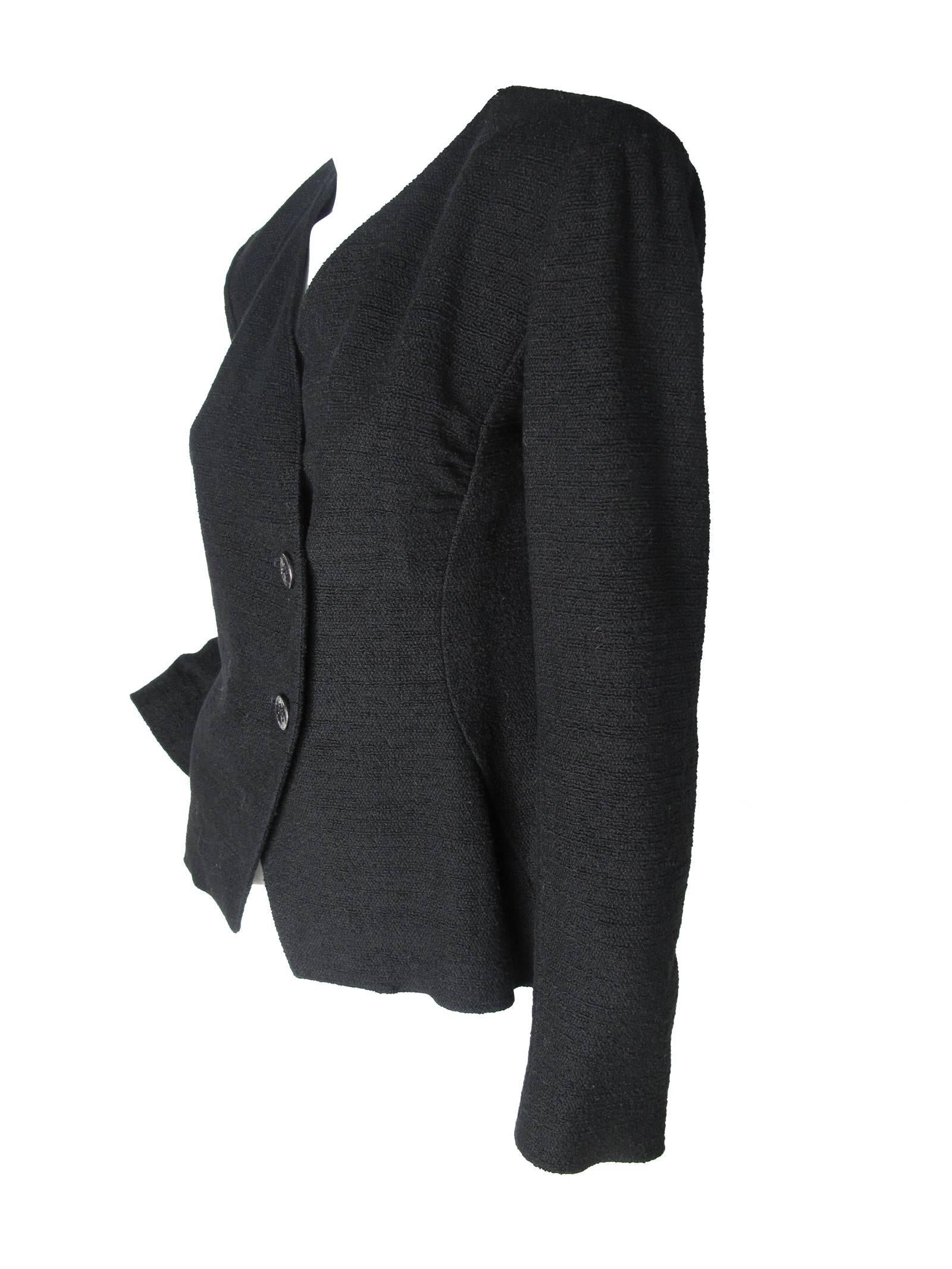 2000 Chanel cotton/ nylon black blazer, two front buttons.  Chain on inside hem. Condition: Excellent. Size 40. 

38