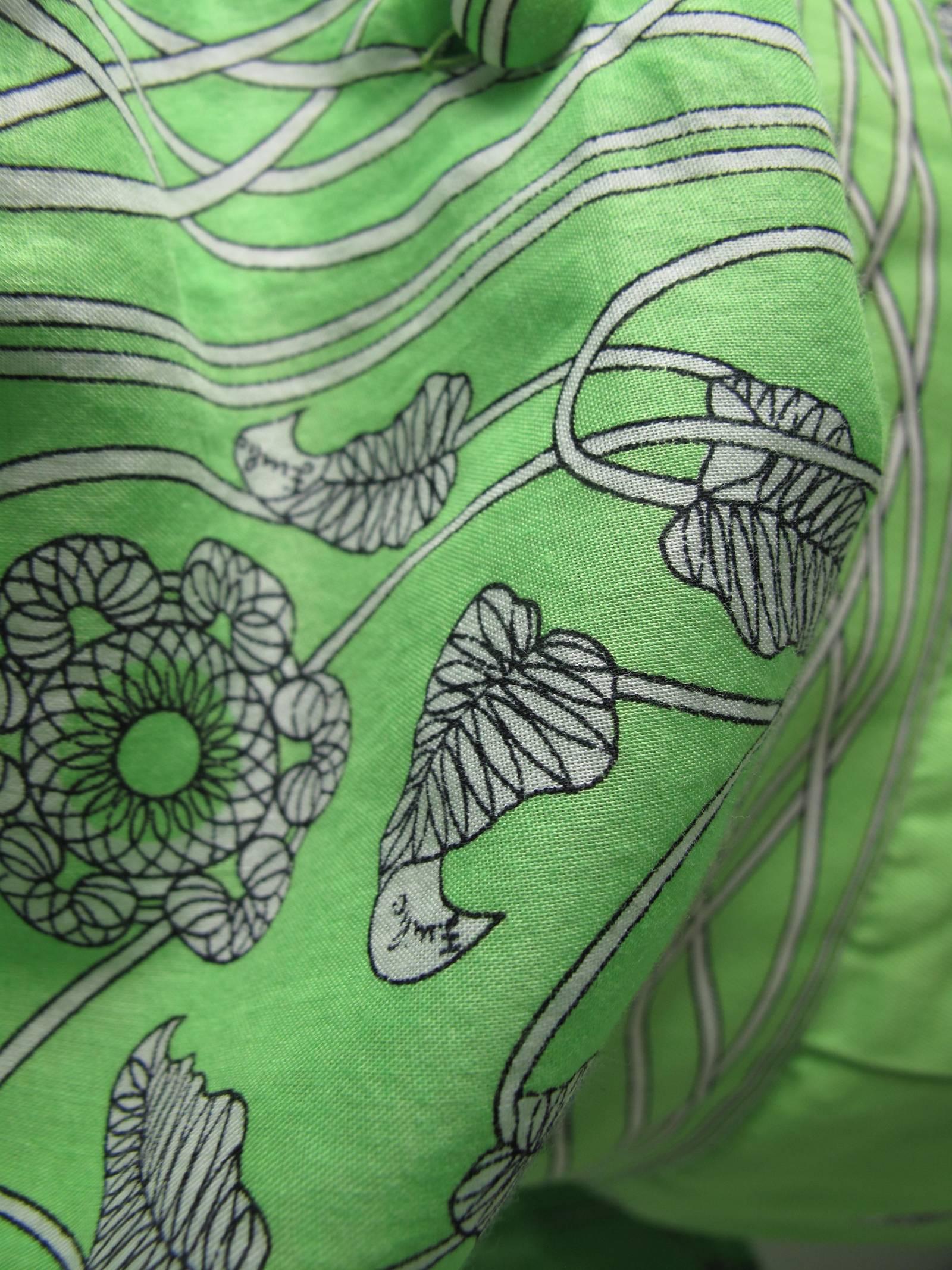 1960s Emilio Pucci green cotton skirt and blouse with floral print.  Condition: Very good, small rust spot on waistband of skirt, see photo and Faint spots on front of skirt.   Made in Italy.  Labeled Size 10 / Current US size 6

Blouse: 37
