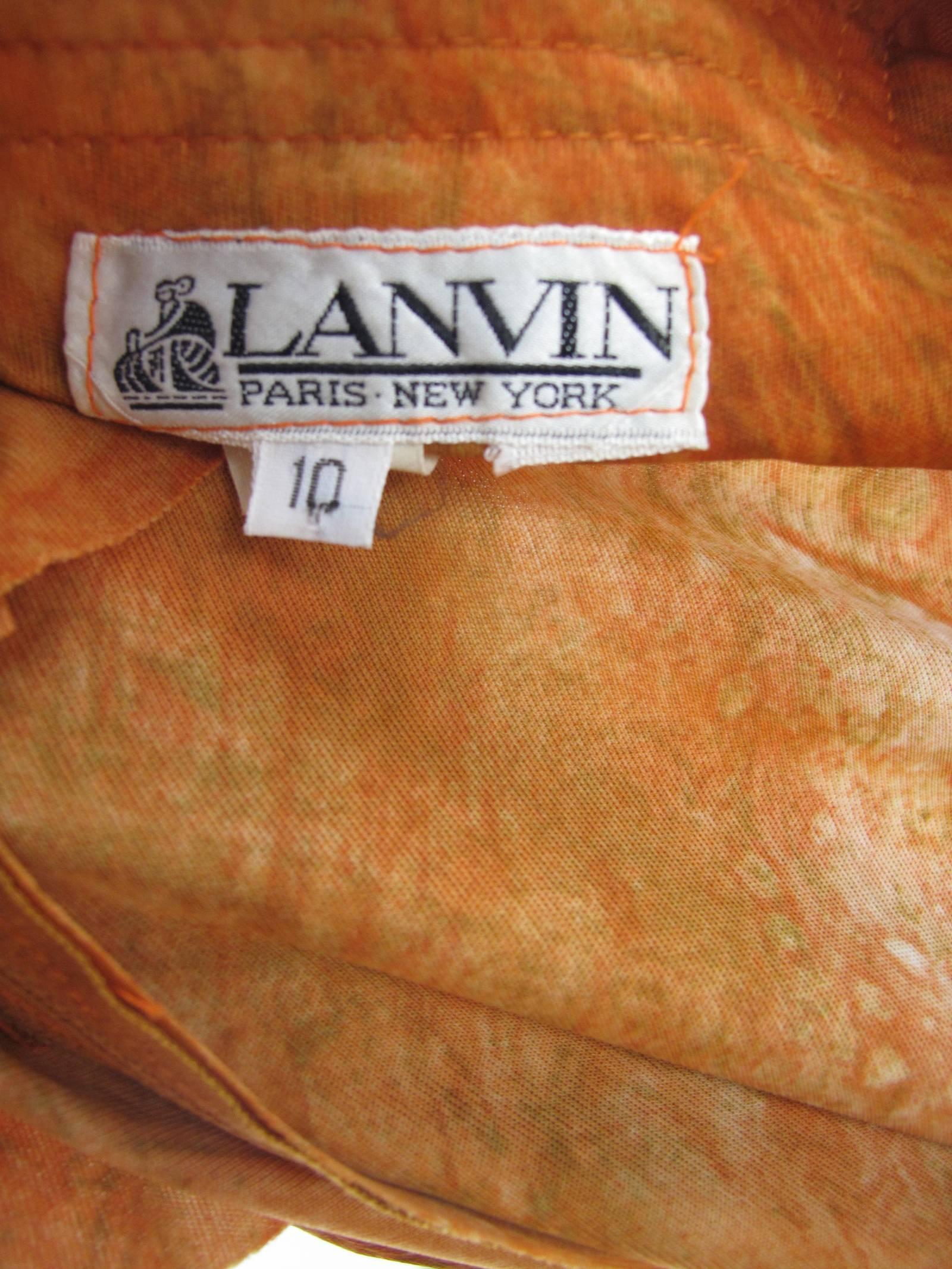 1970s Lanvin orange tie dye top, skirt and belt.  Condition:Excellent. Size 10 / current size 8 -10
Top: 33" bust, 29" waist, 34" hips, 2 1/2" sleeve, 23 1/2" length. 
Skirt: 26" elastic waist, 4" hips, 43"