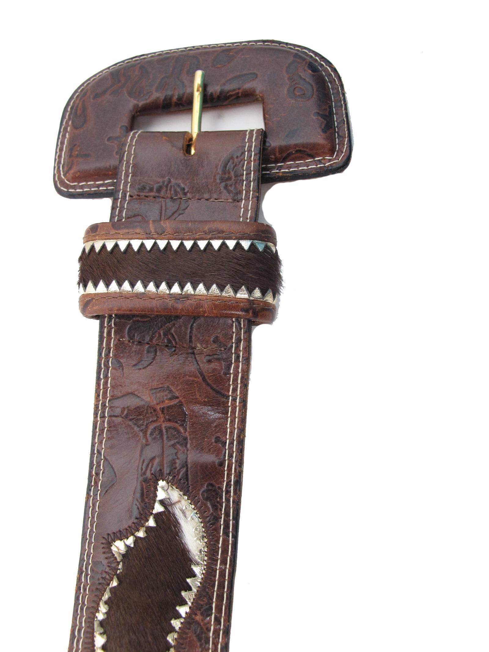 Carlos Falchi brown leather stamped western theme belt with pony fur inserts.  Condition: Good, some wear . fits waist 27 