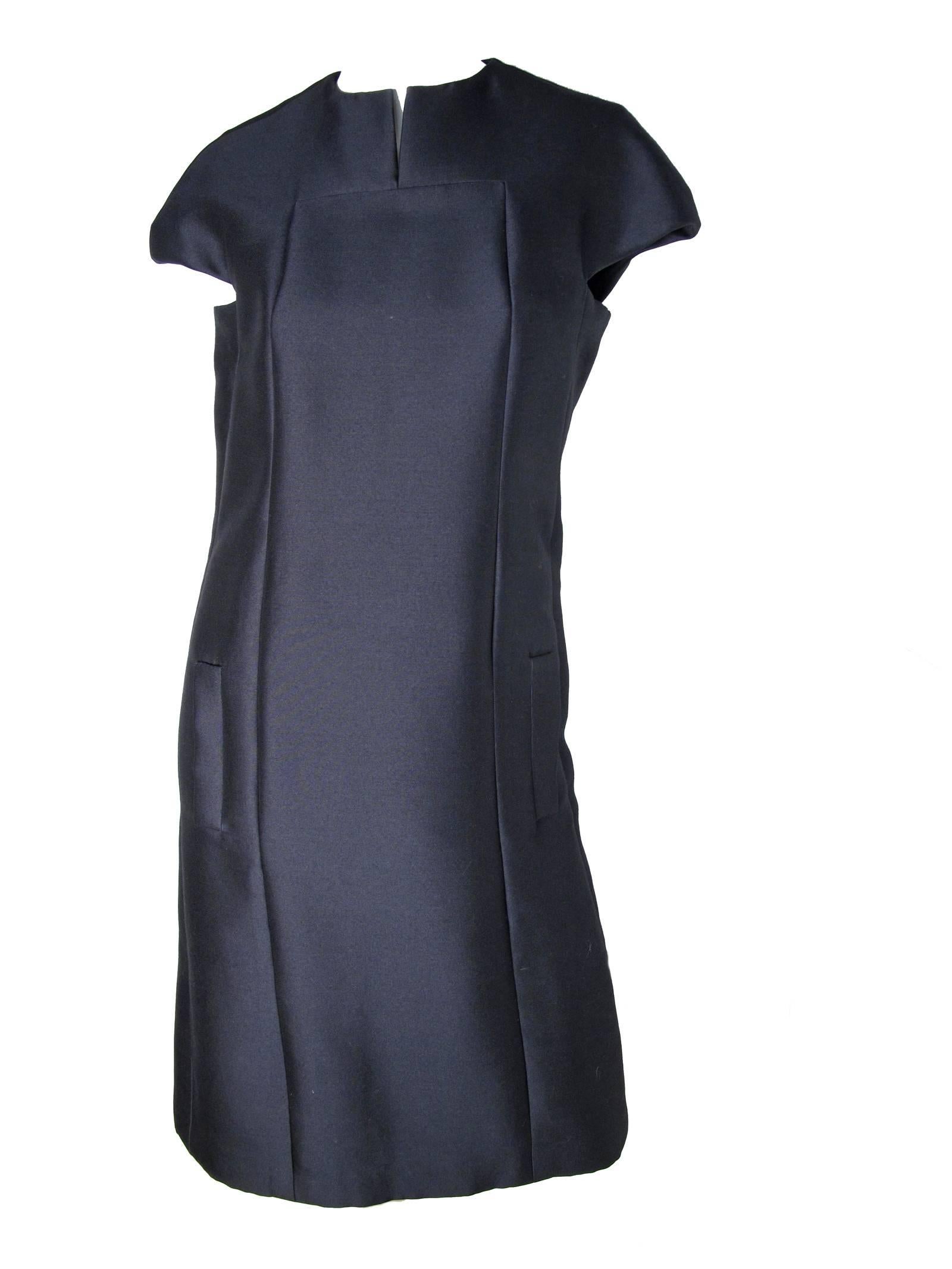 1960s Geoffrey Beene navy silk cocktail dress with side pockets. 
Condition: Excellent. Size 8
approximate measurements: 36
