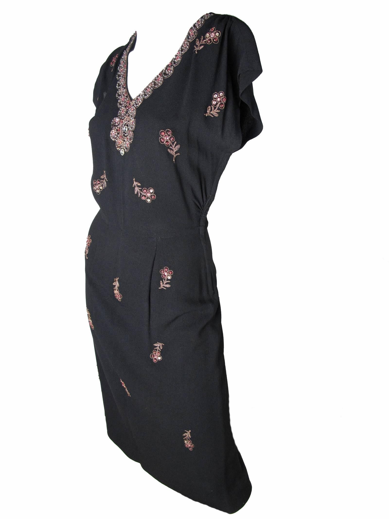 1940s black crepe dress with floral beading. Condition: Very good. 
Size 6.  Approximate measurements: 36