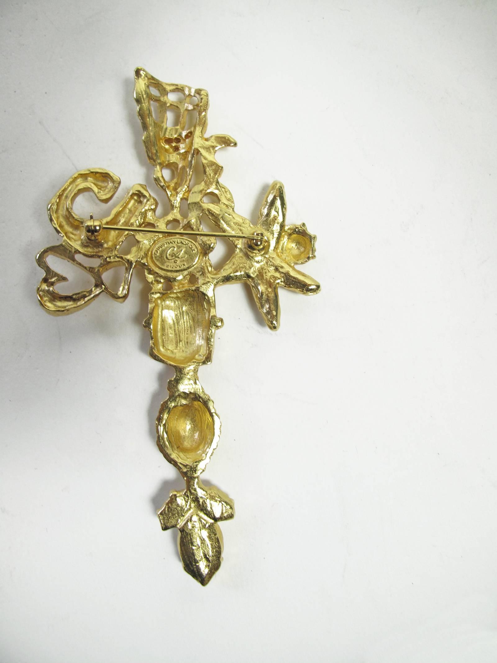 Christian Lacroix large gold tone cross pin with rhinestones.  Condition: Excellent.  4 1/4" L x 2 1/4" W 